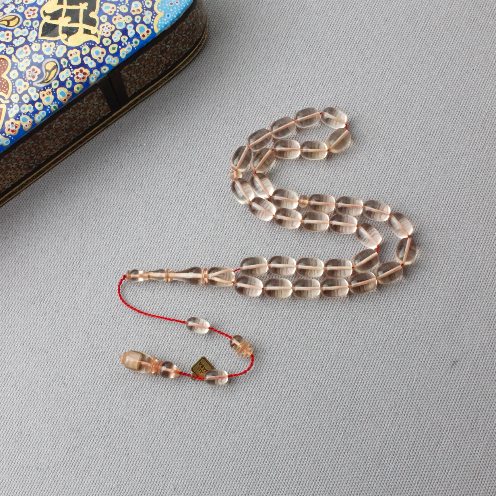 Ali Baba Usta İmzalı Şeffaf Renk Kapsül Kesim Ateş Kehribar Tespih