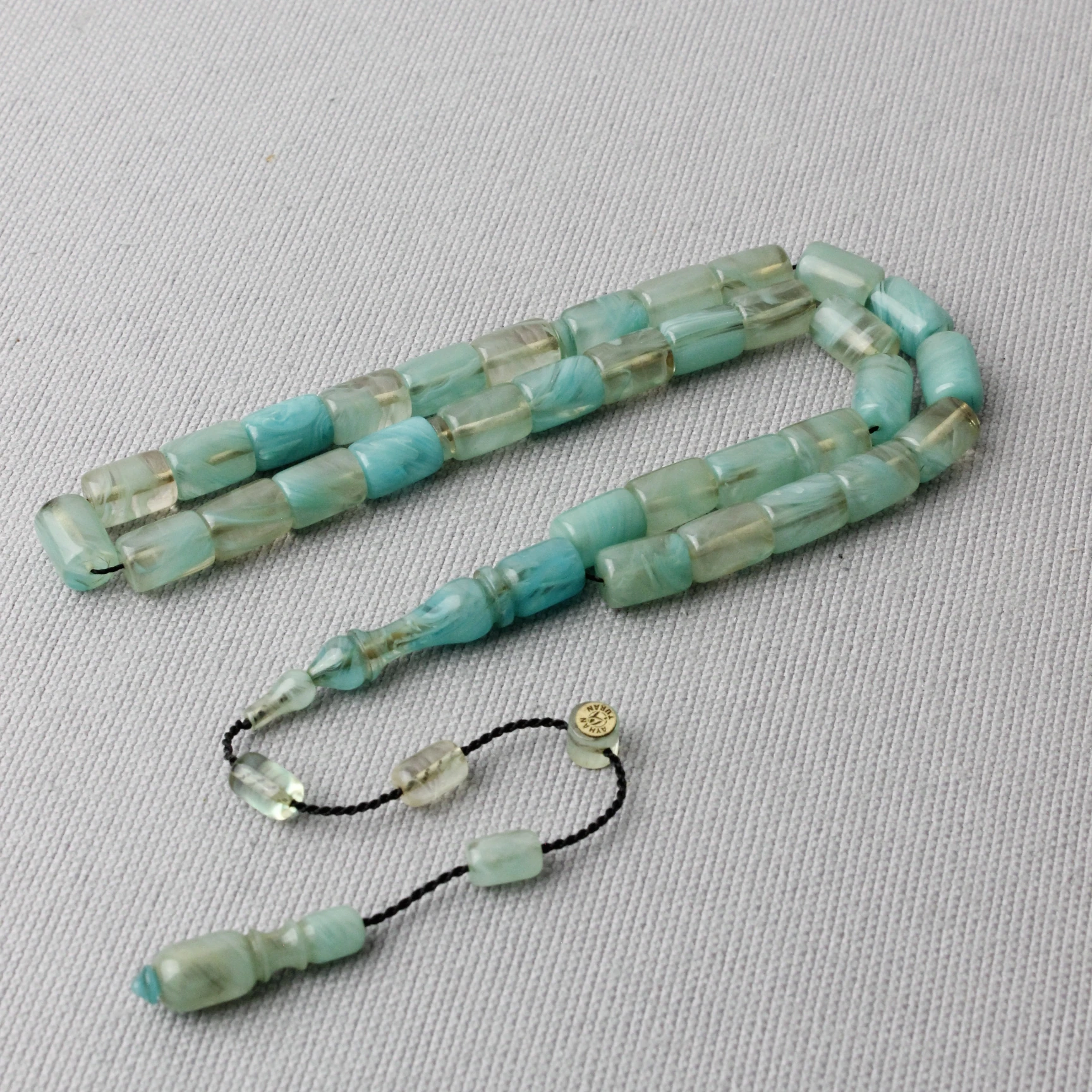 Ayhan Turan Usta İmzalı Deniz Mavisi Hareli Kapsül Kesim Sıkma Kehribar Tespih