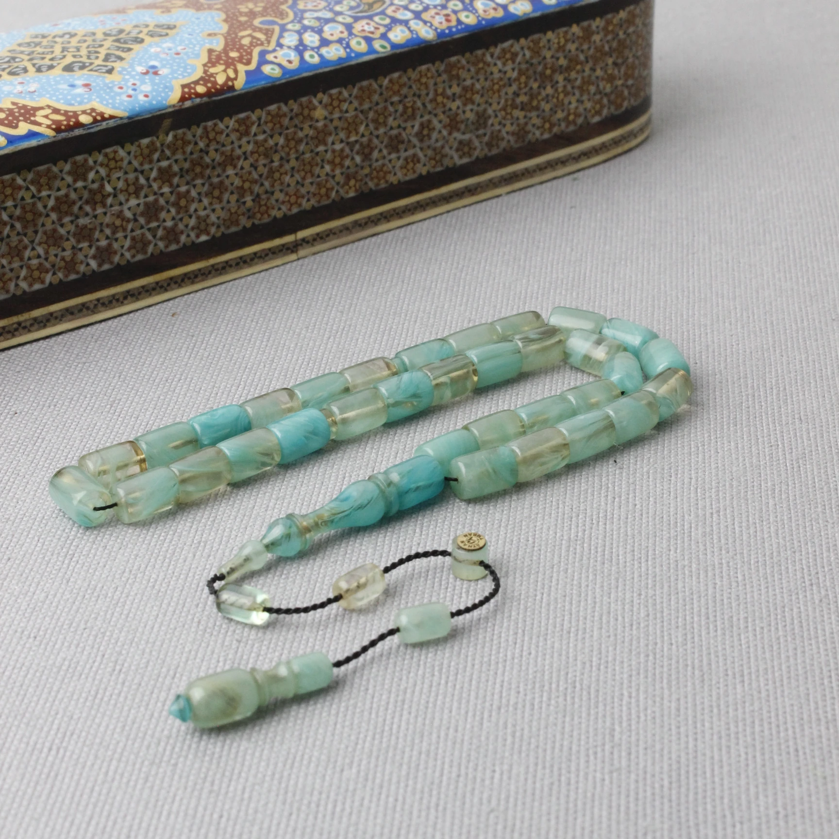 Ayhan Turan Usta İmzalı Deniz Mavisi Hareli Kapsül Kesim Sıkma Kehribar Tespih