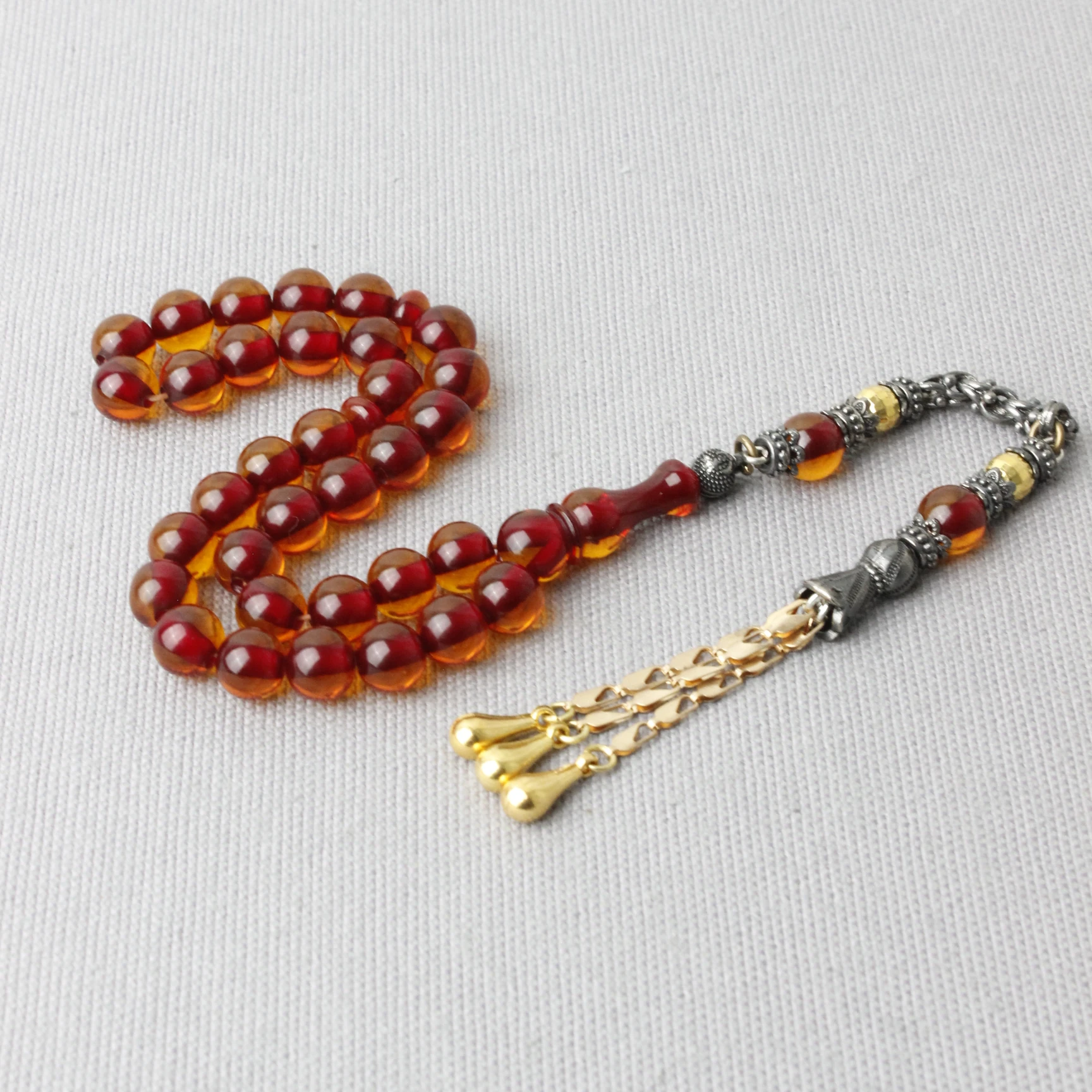 Küre Kesim Çelik Püsküllü Ateş Kehribar Tespih 