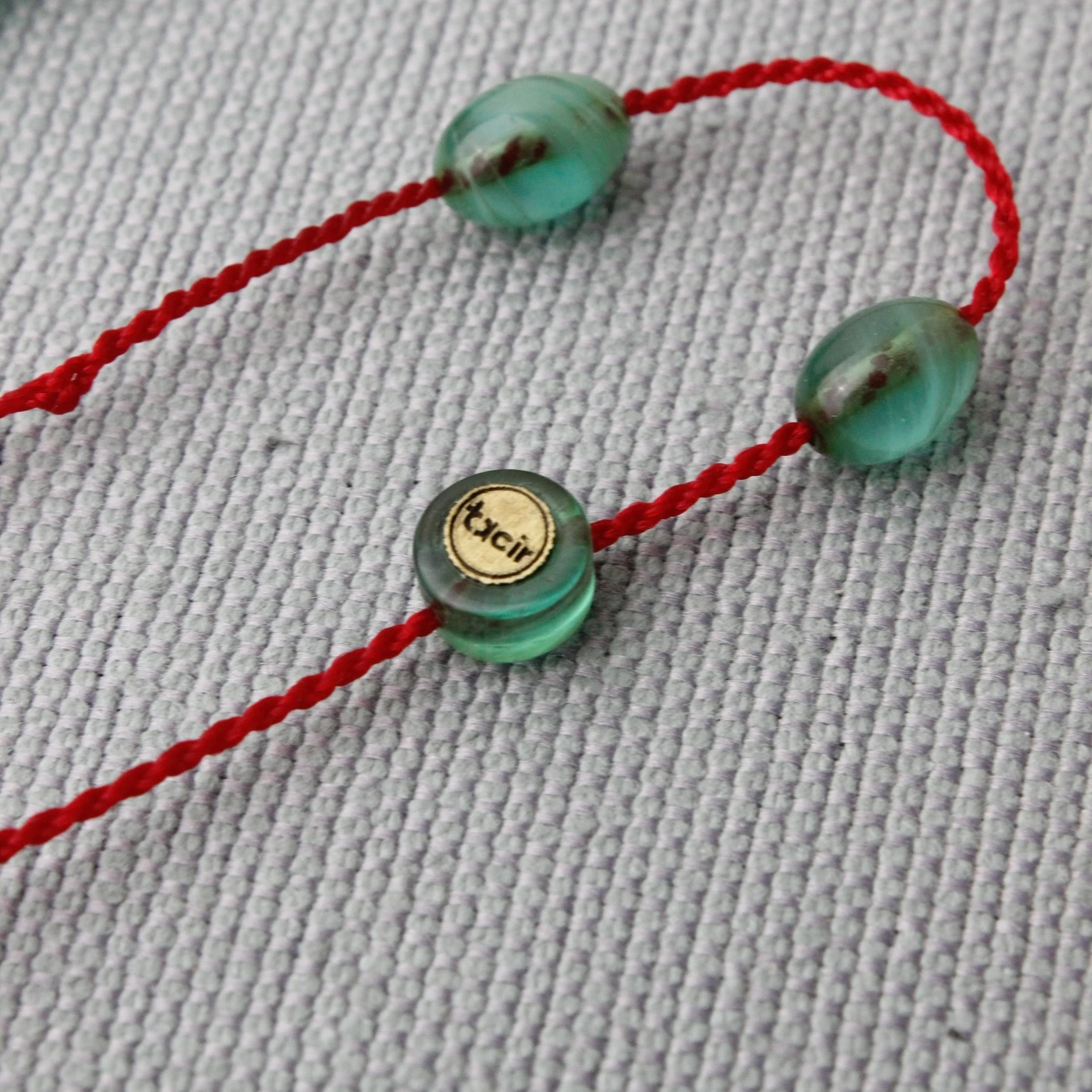 Hareli Turkuaz Renk Tacir İmzalı Sıkma Kehribar Tespih