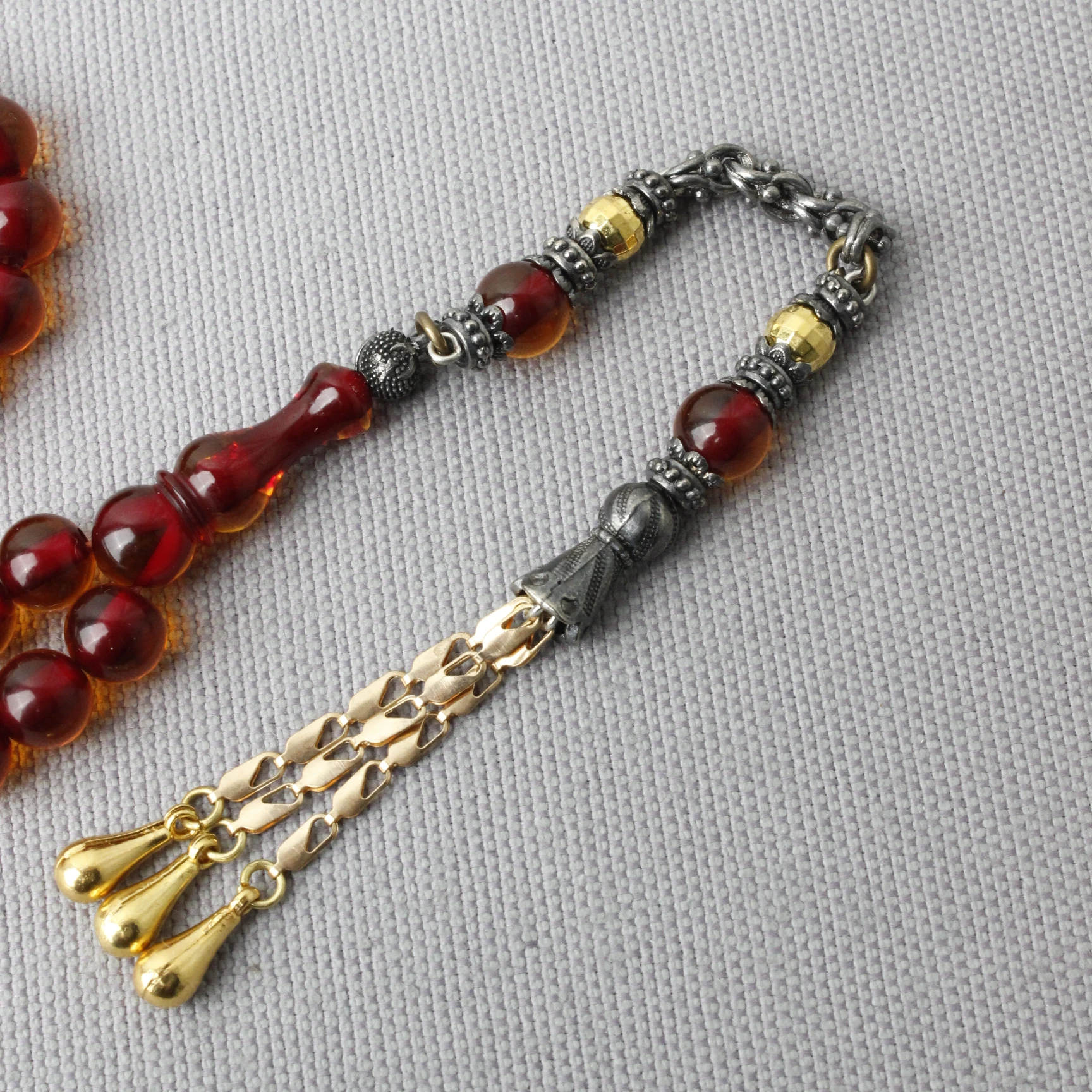 Küre Kesim Çelik Püsküllü Ateş Kehribar Tespih 