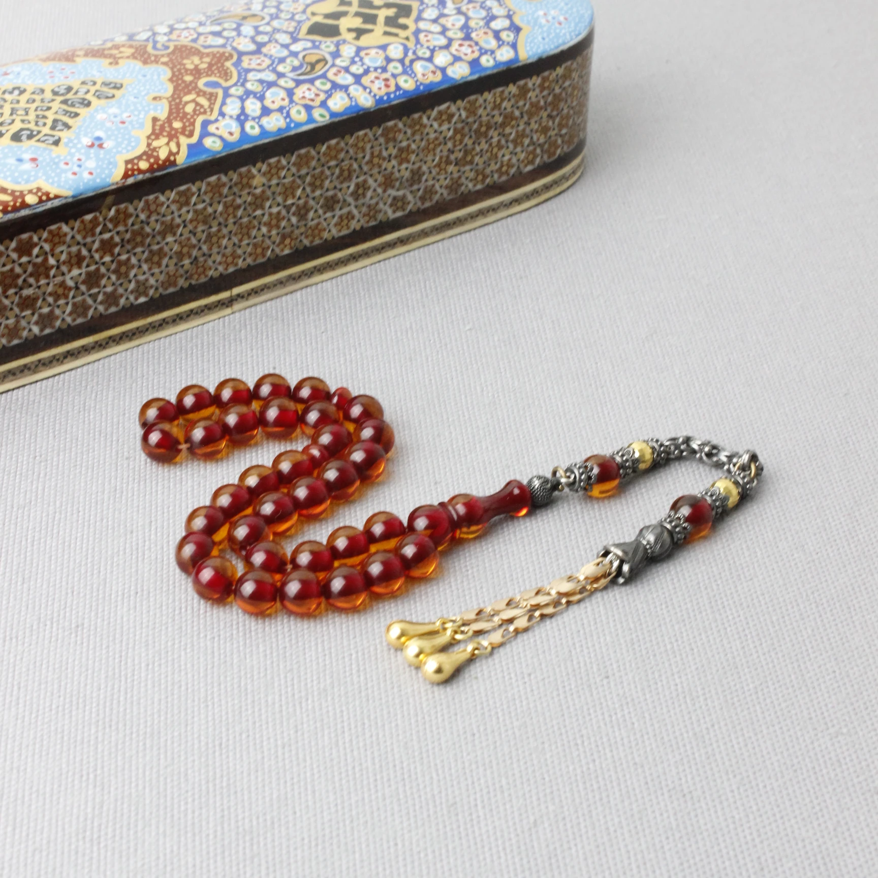 Küre Kesim Çelik Püsküllü Ateş Kehribar Tespih 