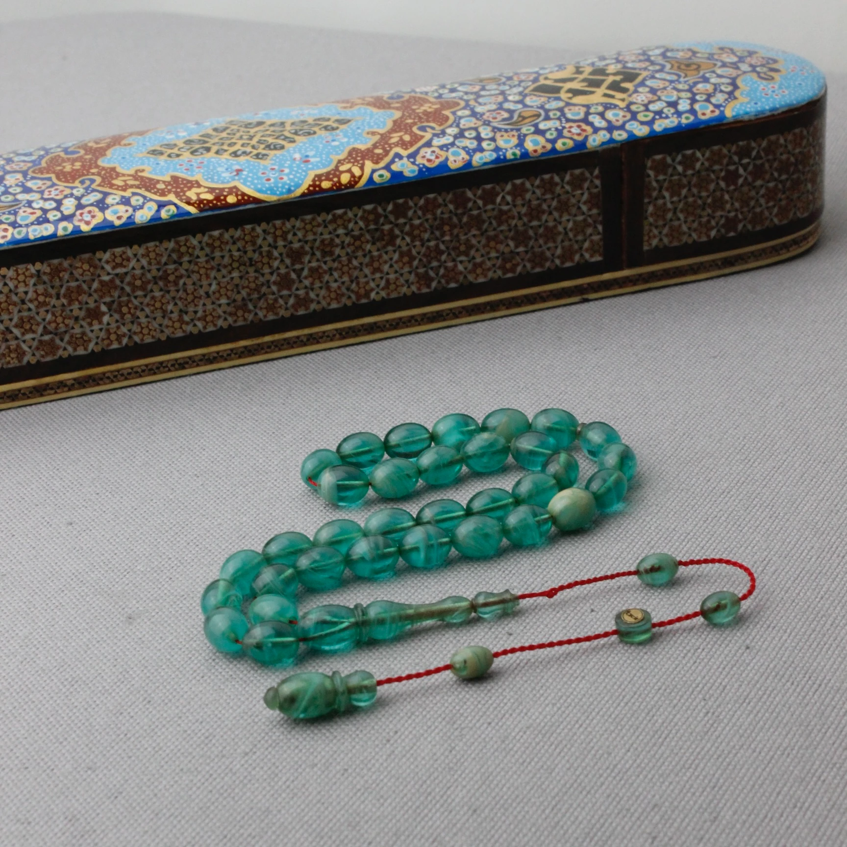 Hareli Turkuaz Renk Tacir İmzalı Sıkma Kehribar Tespih