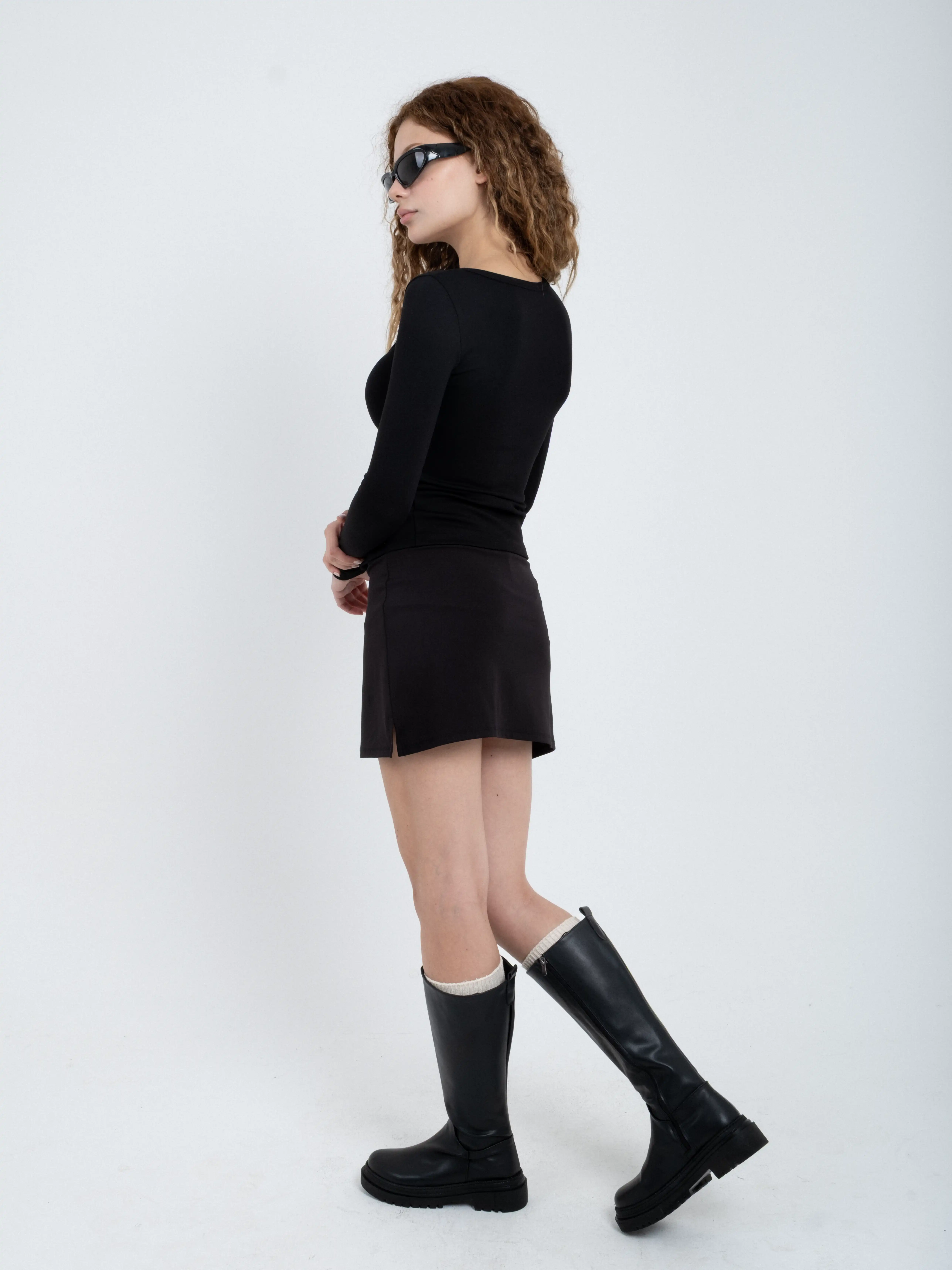 Blusa body de manga larga con broches asimétricos