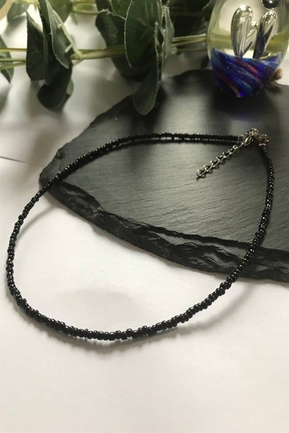 Female black bead necklace