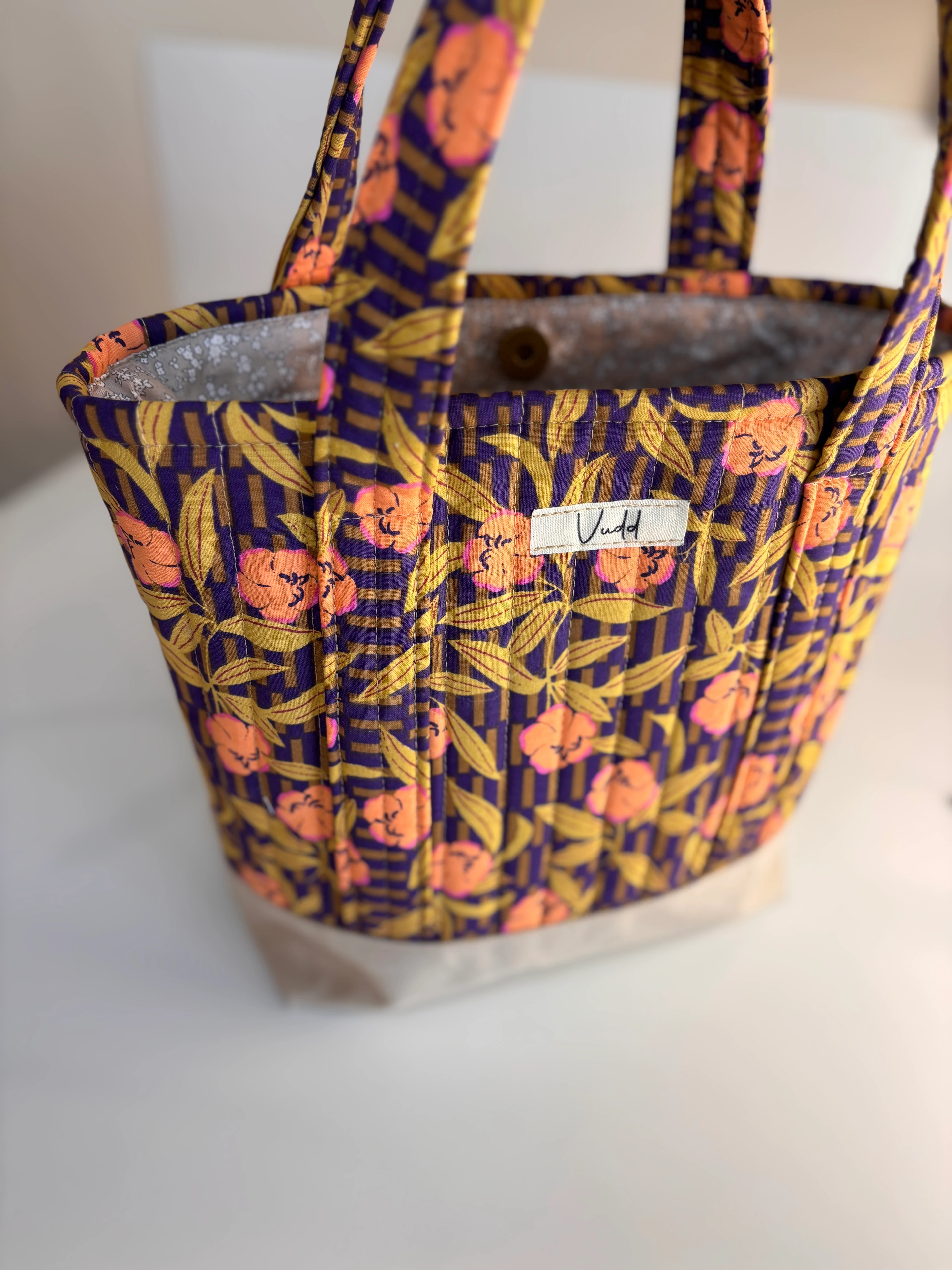 kapitone çiçekli el çantası