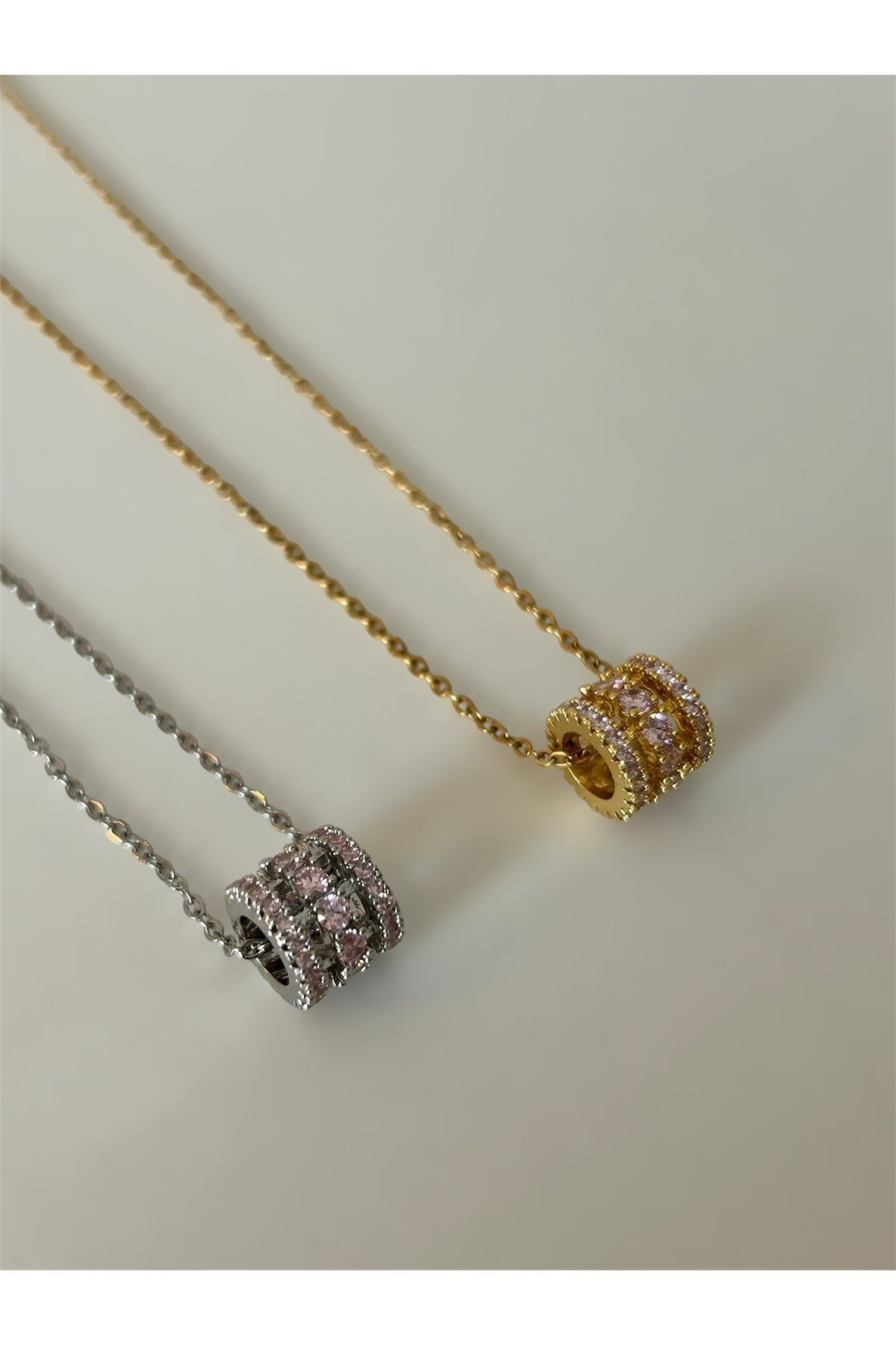 Pembe Taşlı Silindir Gold Çelik Kolye
