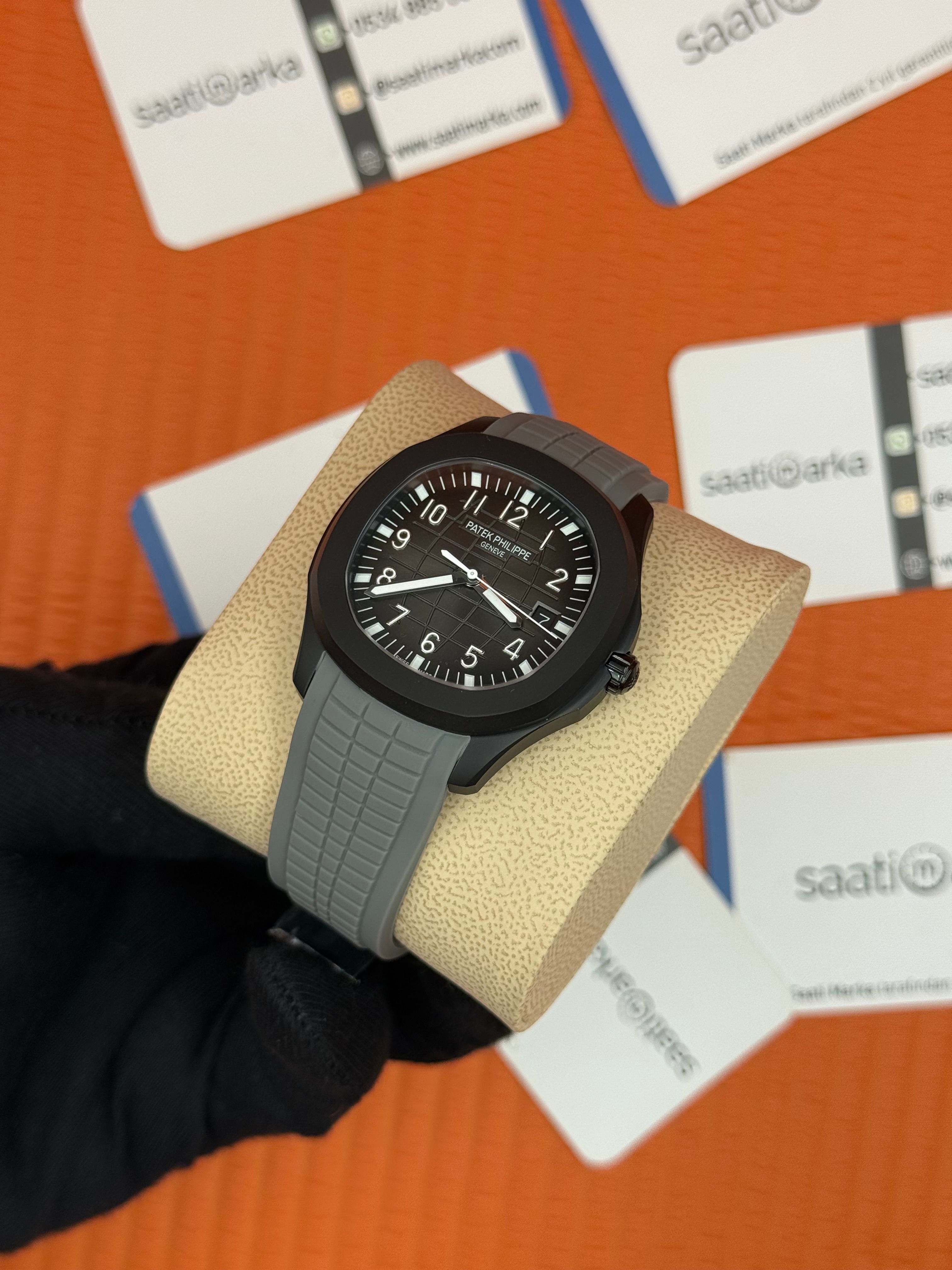 PATEK PHILIPPE Aquanaut gri kadran gri kauçuk kordon siyah çelik kasa 