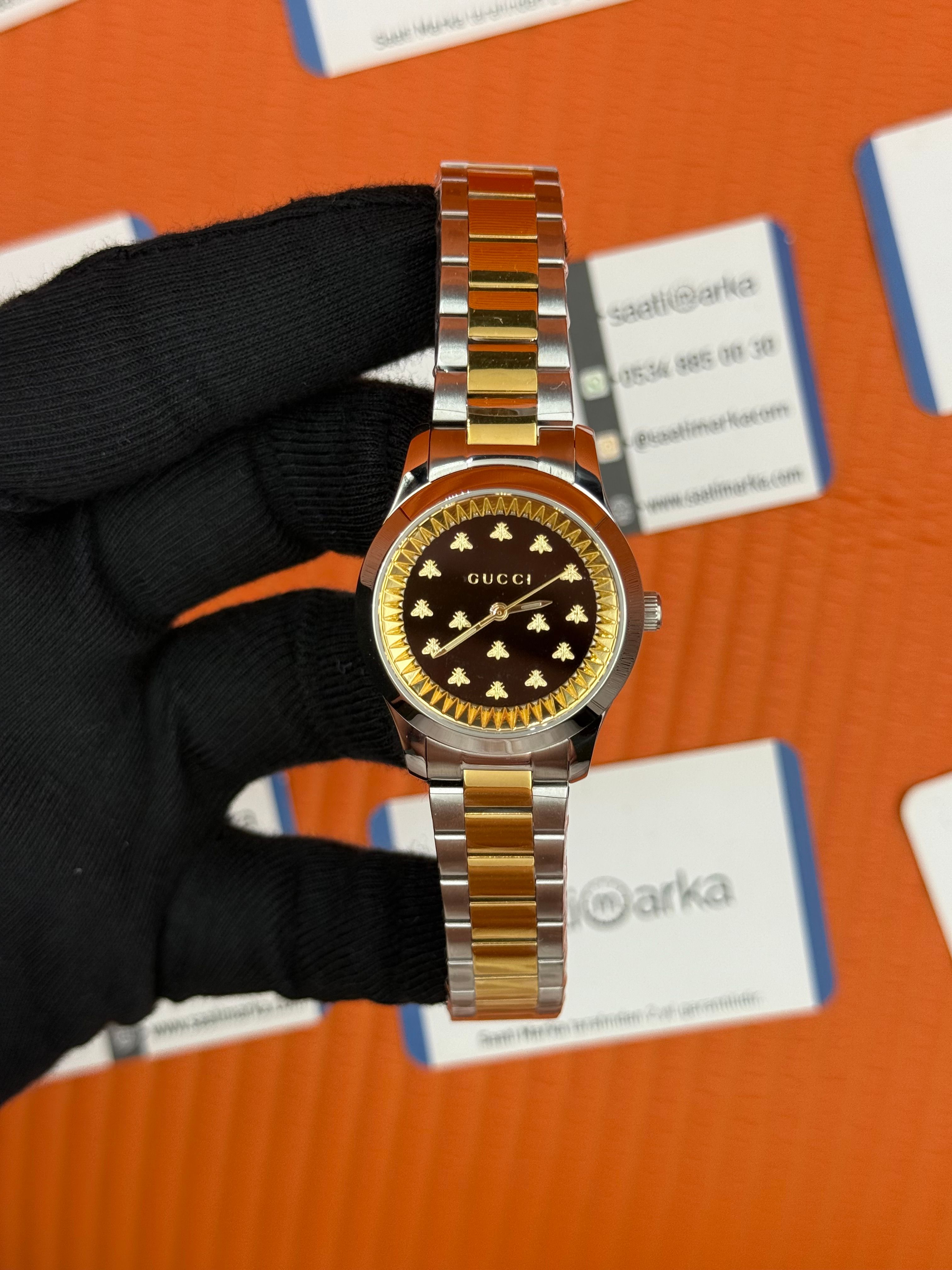 GUCCI siyah kadran gold silver kasa-kordon kadın kol saati