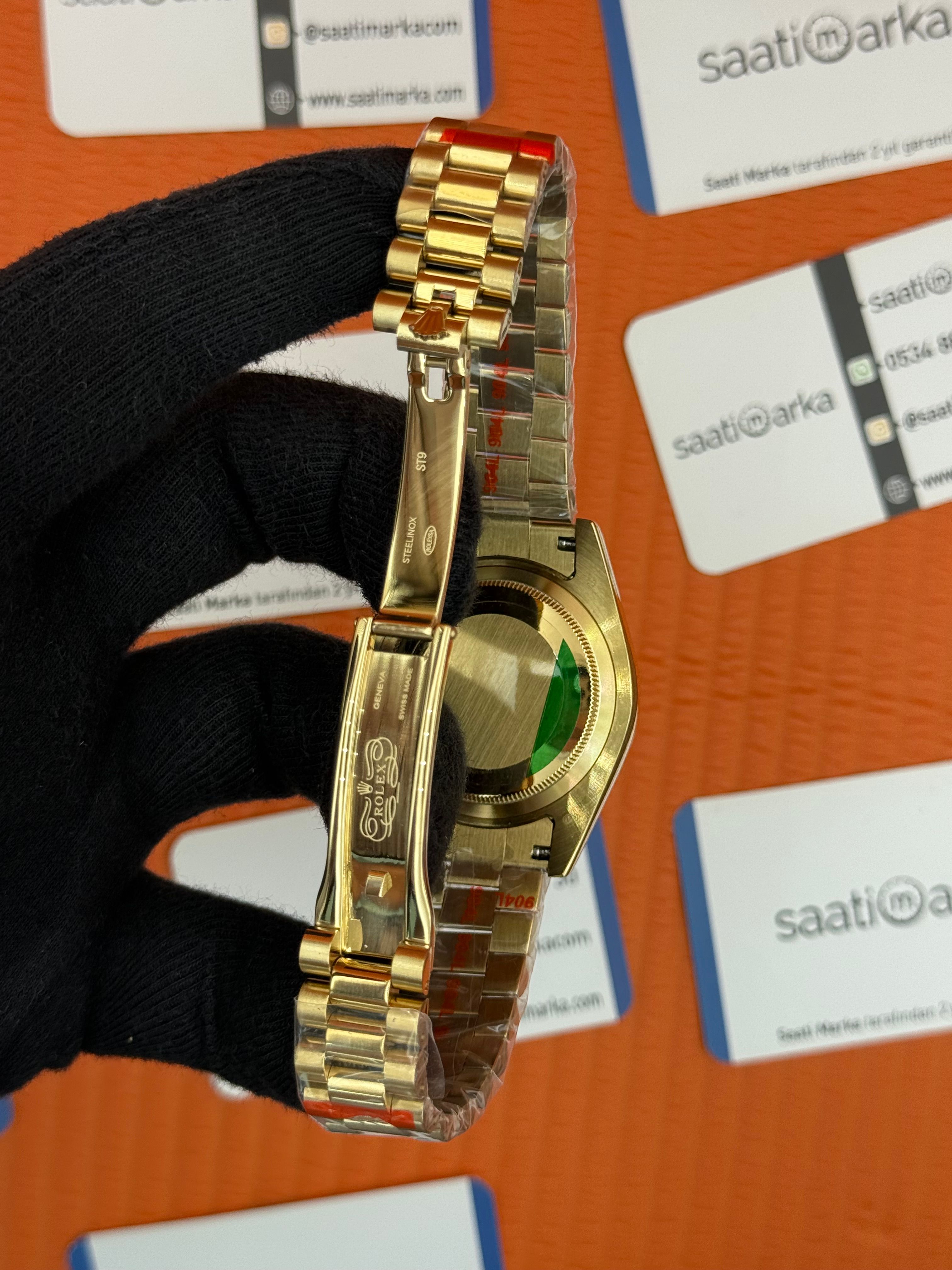 ROLEX Day Date taşlı bezel black dial gold president kordon