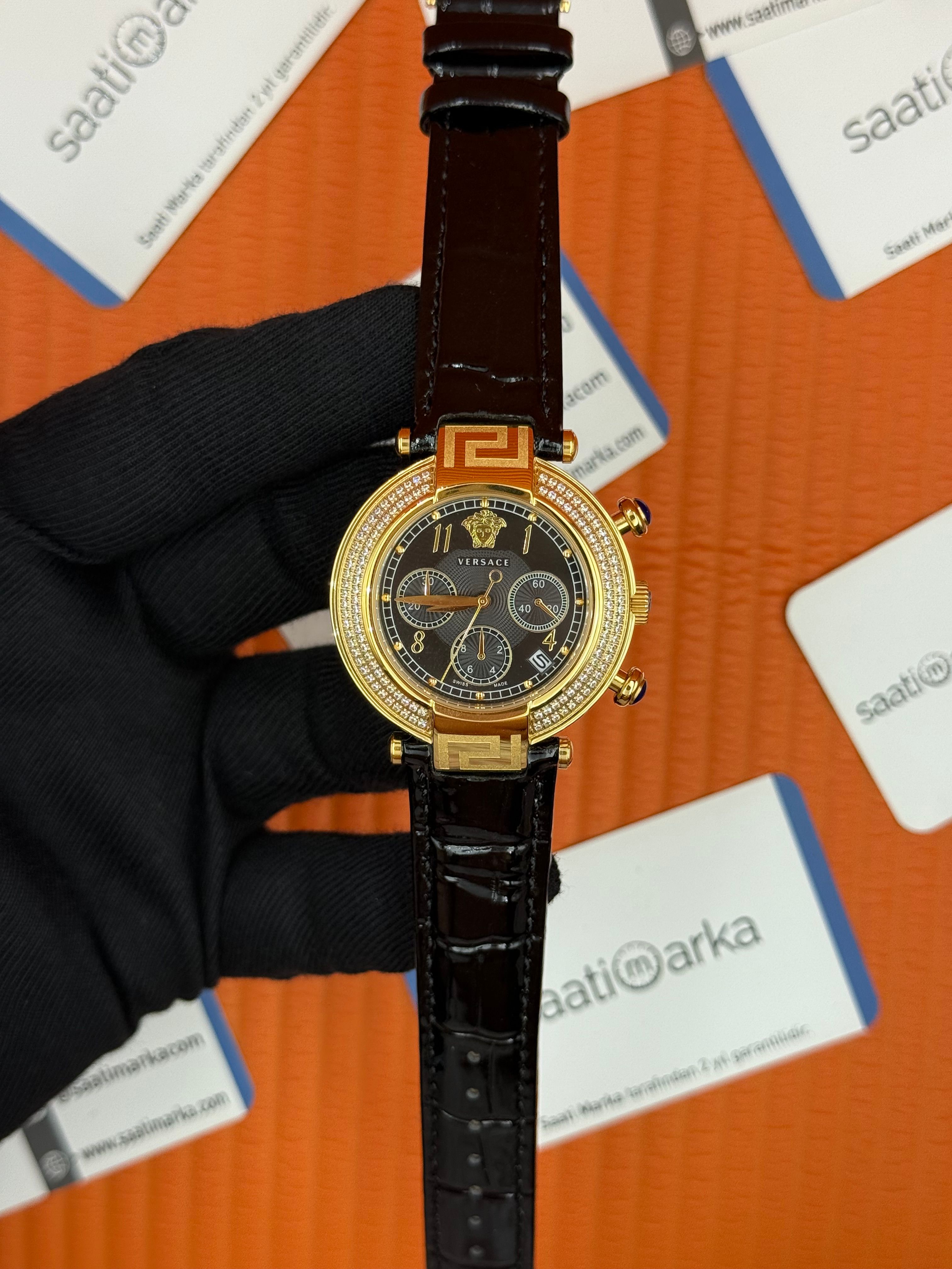 VERSACE taşlı bezel siyah kadran siyah deri kordon gold kasa kadın kol saati
