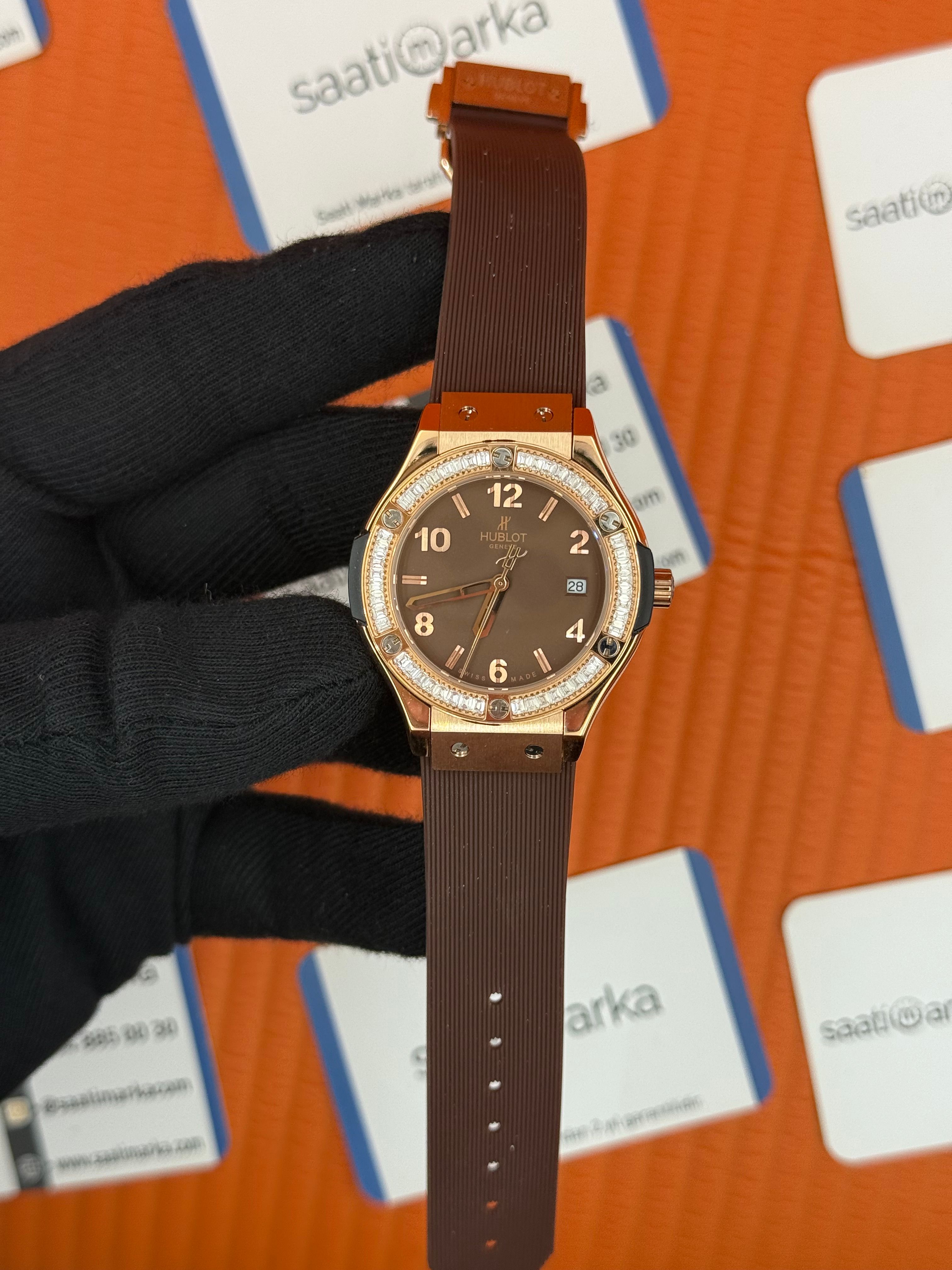 HUBLOT taşlı bezel kahverengi kadran rose kasa kahverengi kauçuk kordon kadın kol saati