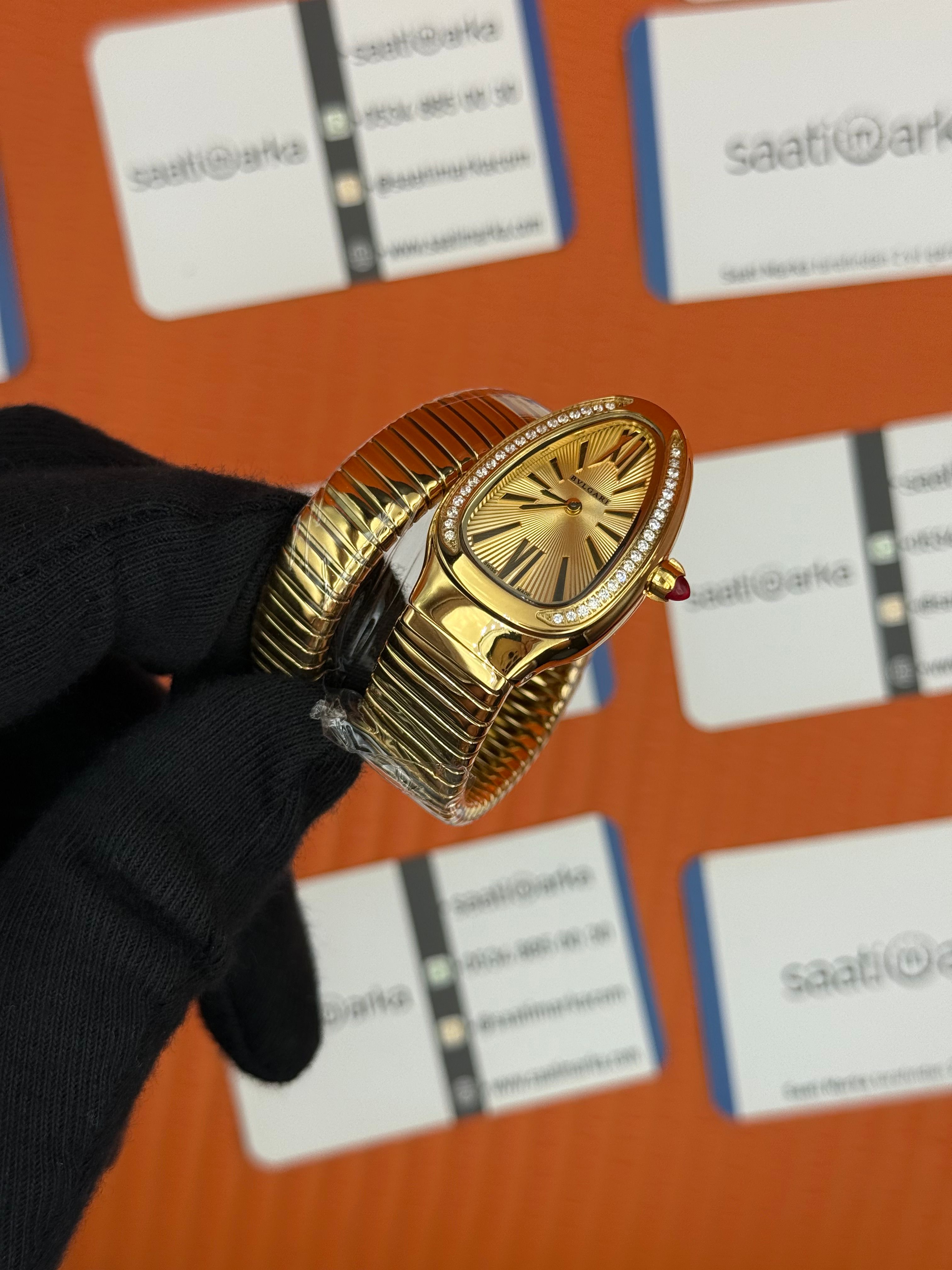 BVLGARİ serpenti tek sarma gold kordon taşlı bezel şampanya kadran kadın kol saati