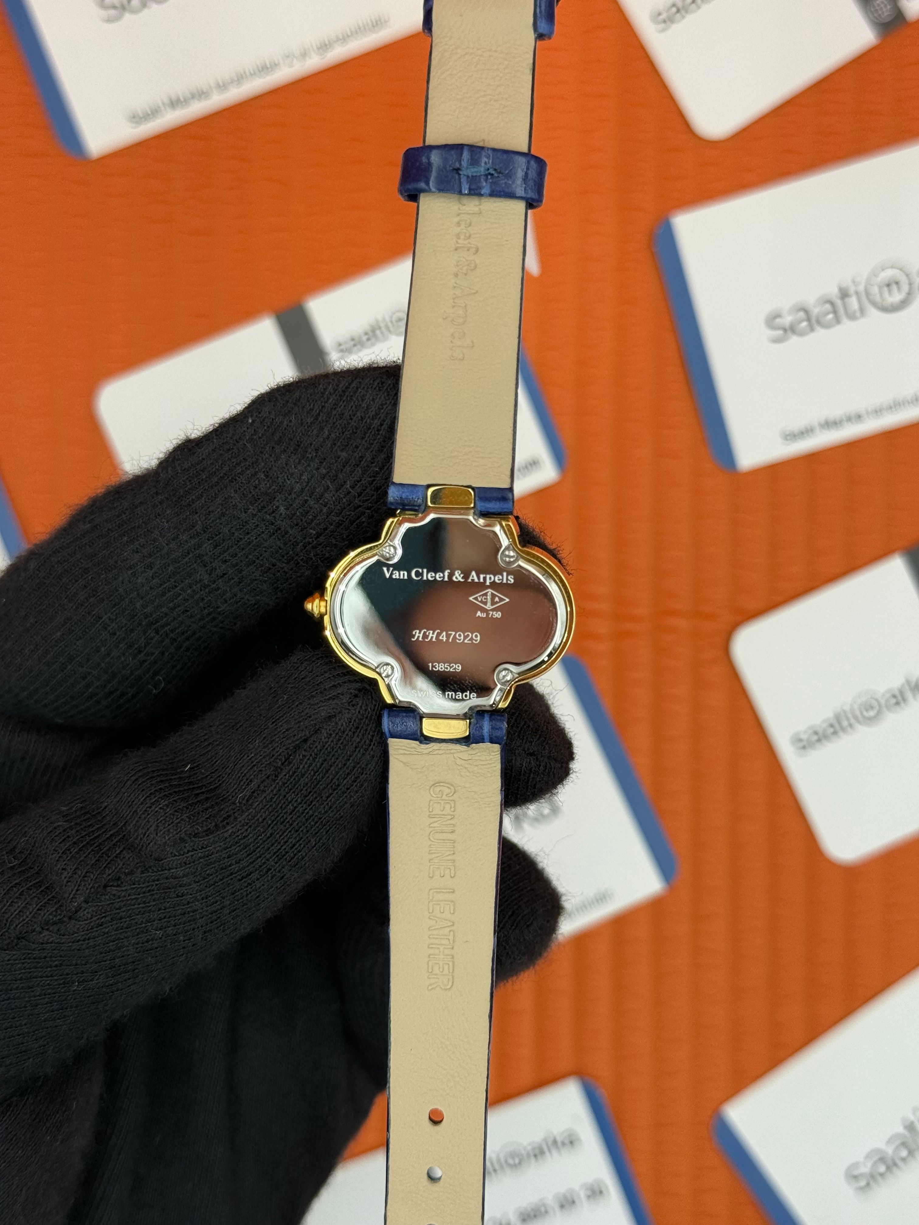 VAN CLEEF beyaz kadran lacivert deri kordon gold kasa taşlı bezel kadın kol saati