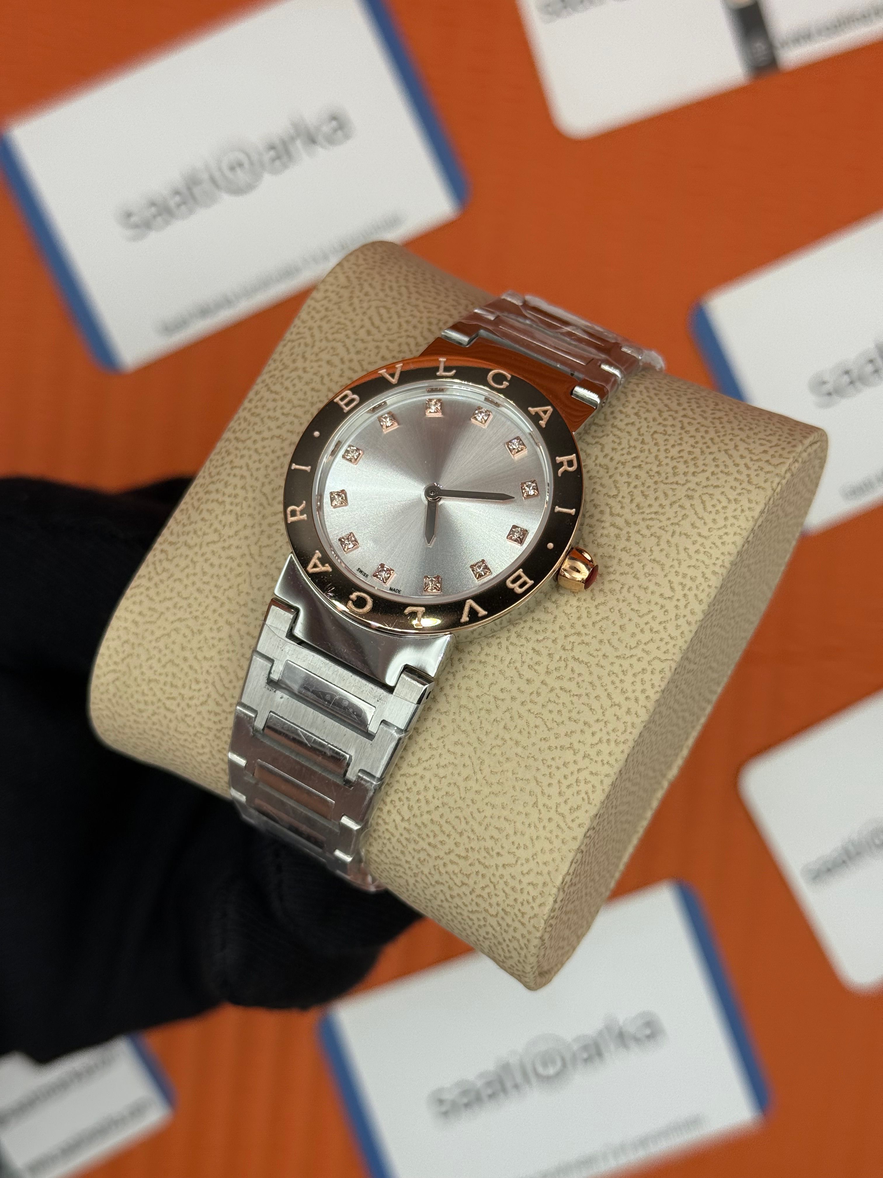 BVLGARI beyaz kadran rose yazılı bezel silver kasa kordon kadın kol saati