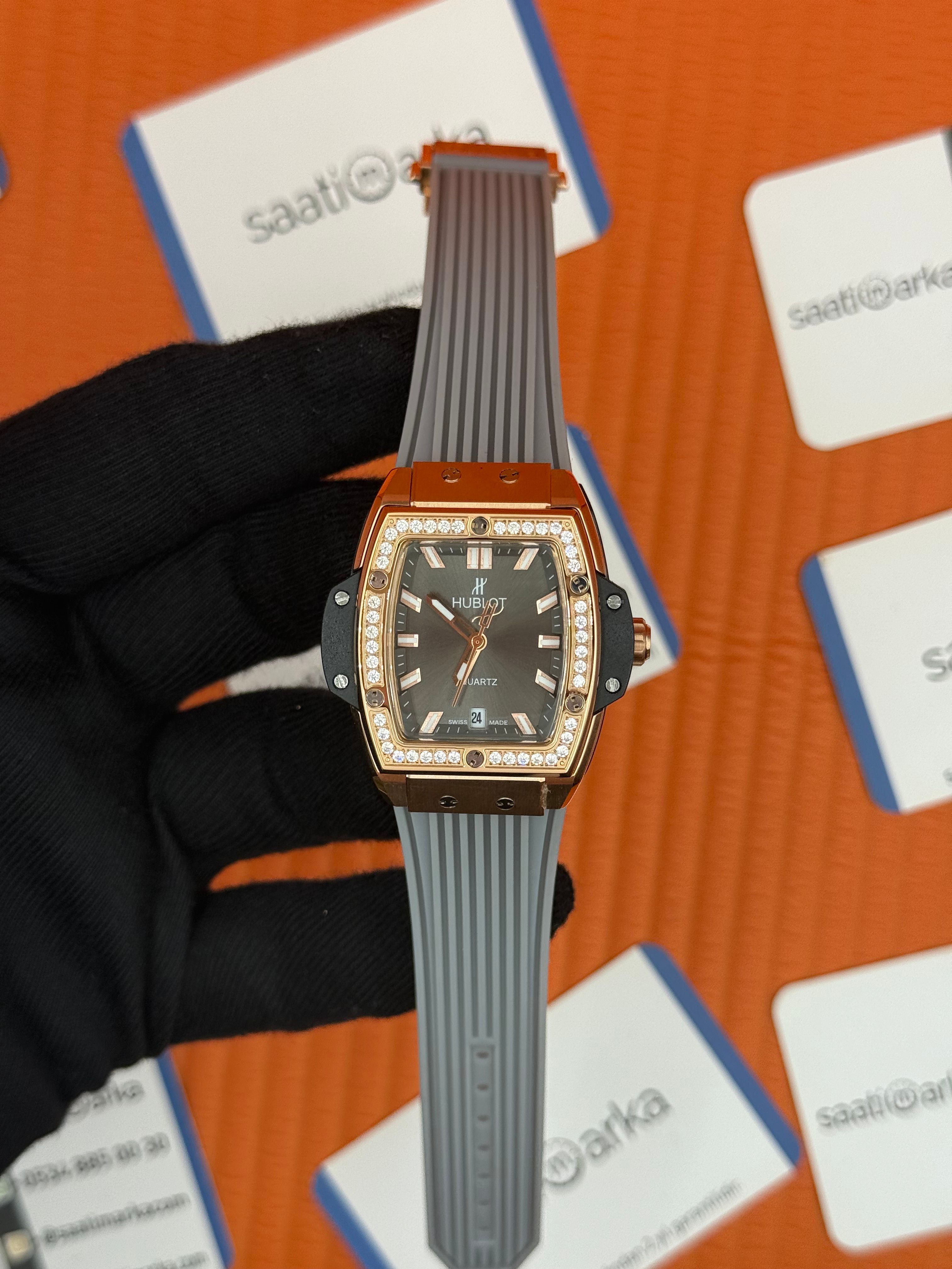 HUBLOT taşlı bezel rose kasa gri kadran gri kauçuk kordon kadın kol saati