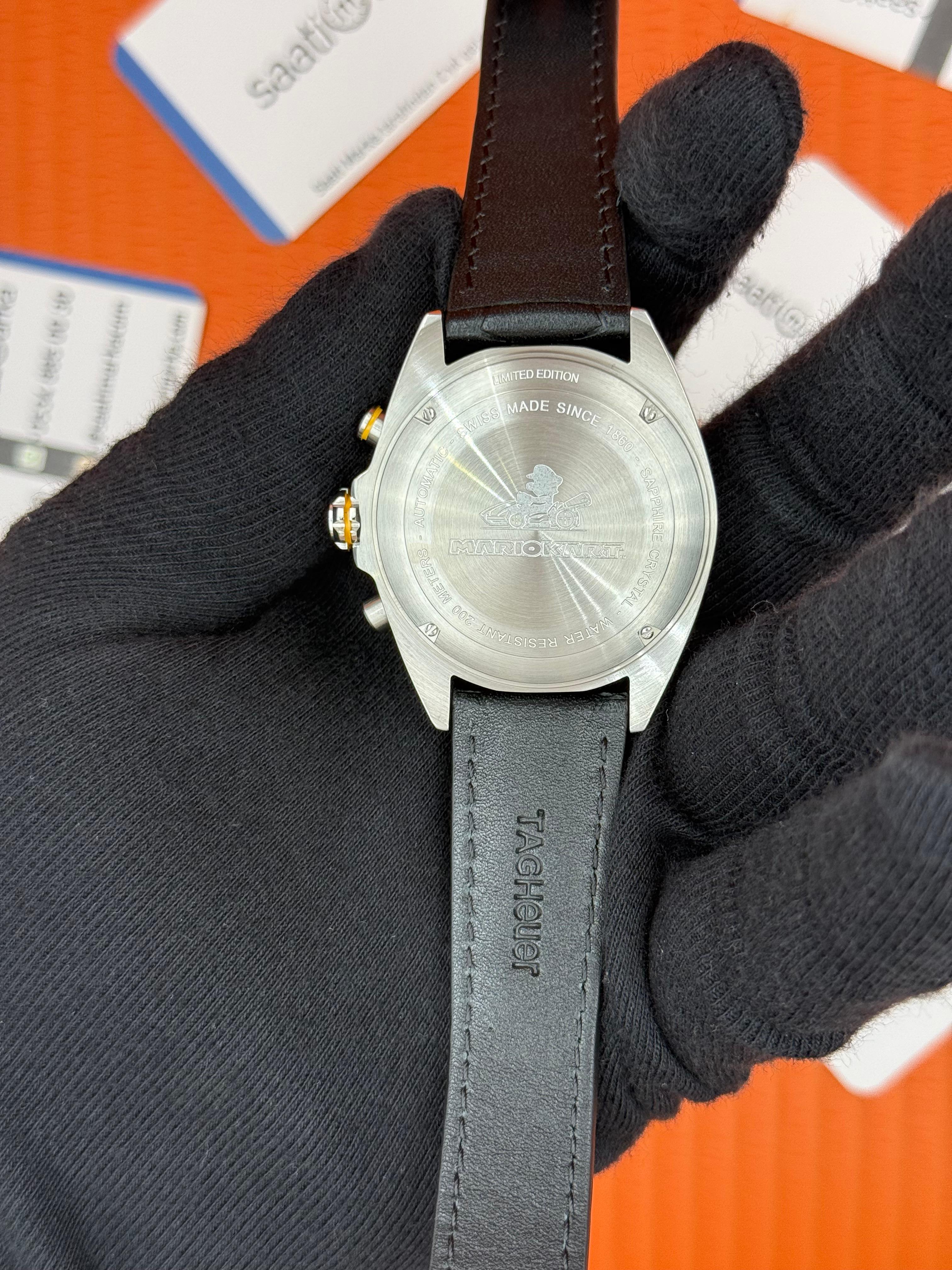 TAGHEUER FORMULA SİYAH DERİ KORDONLU SİYAH SARI DETAYLI KADRAN 