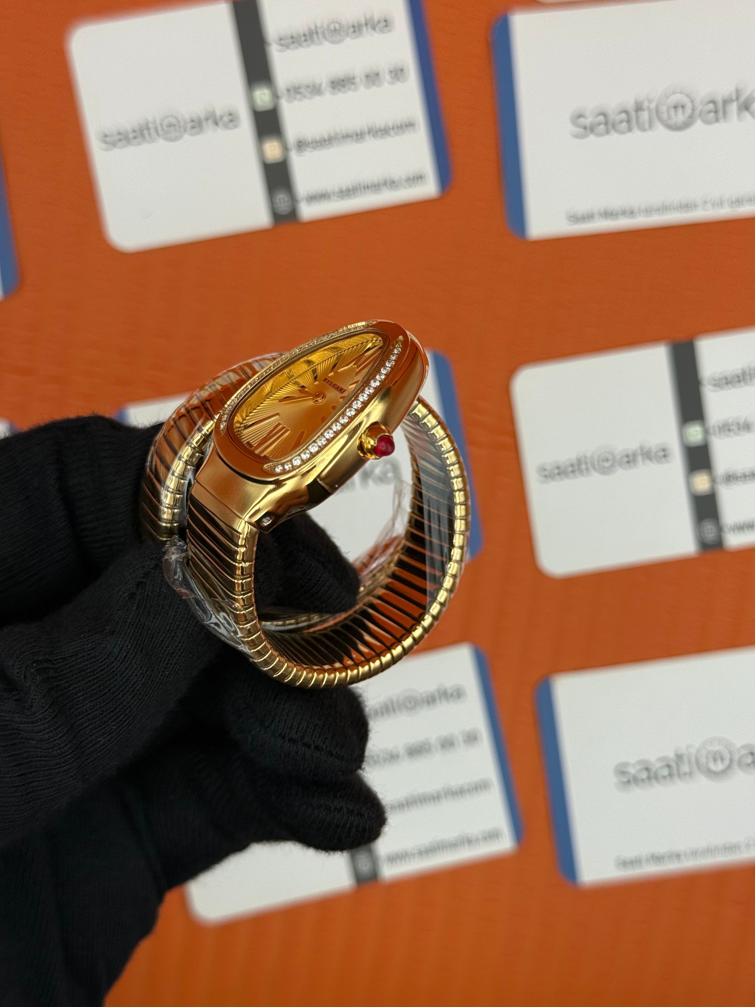 BVLGARİ serpenti tek sarma gold kordon taşlı bezel şampanya kadran kadın kol saati
