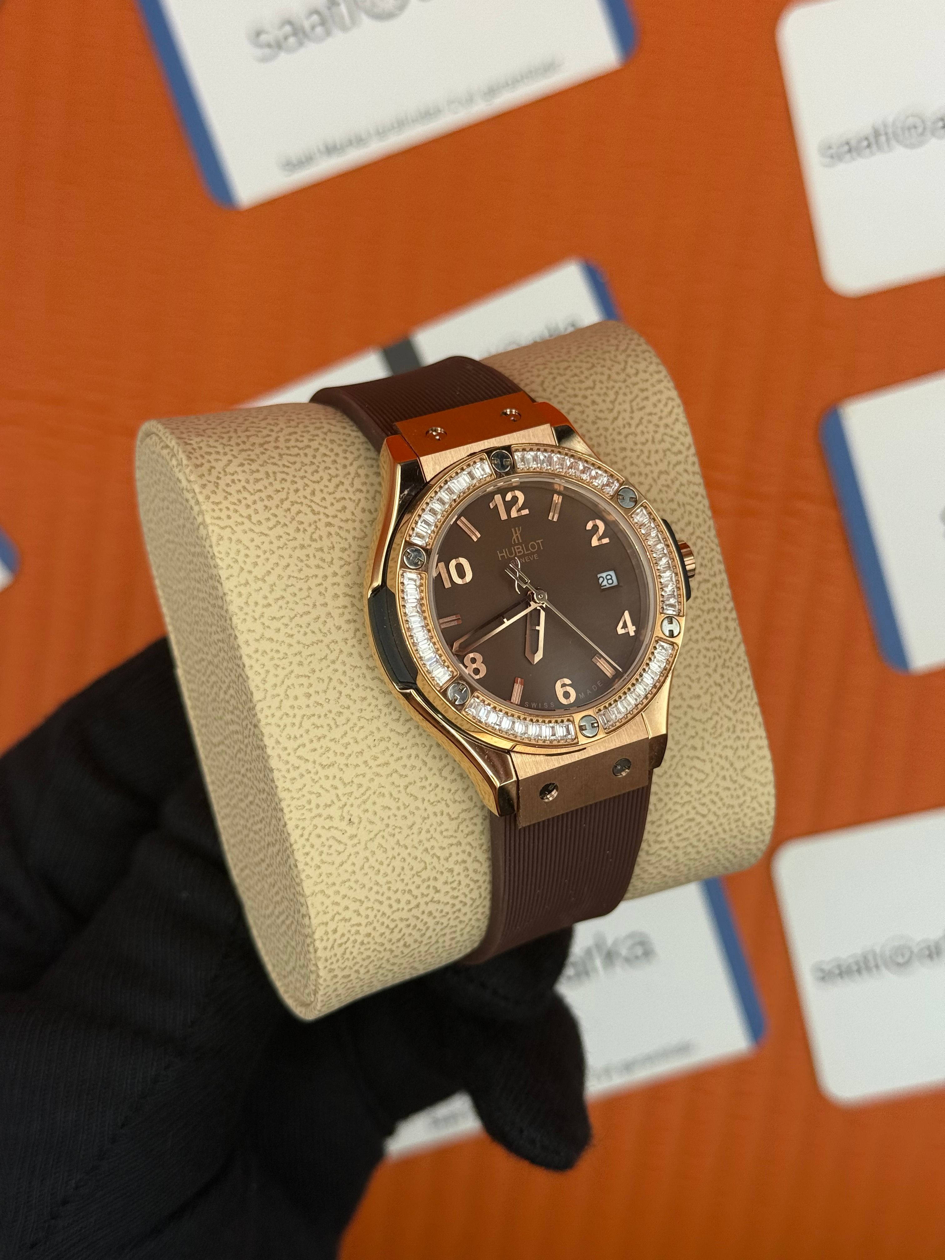 HUBLOT taşlı bezel kahverengi kadran rose kasa kahverengi kauçuk kordon kadın kol saati