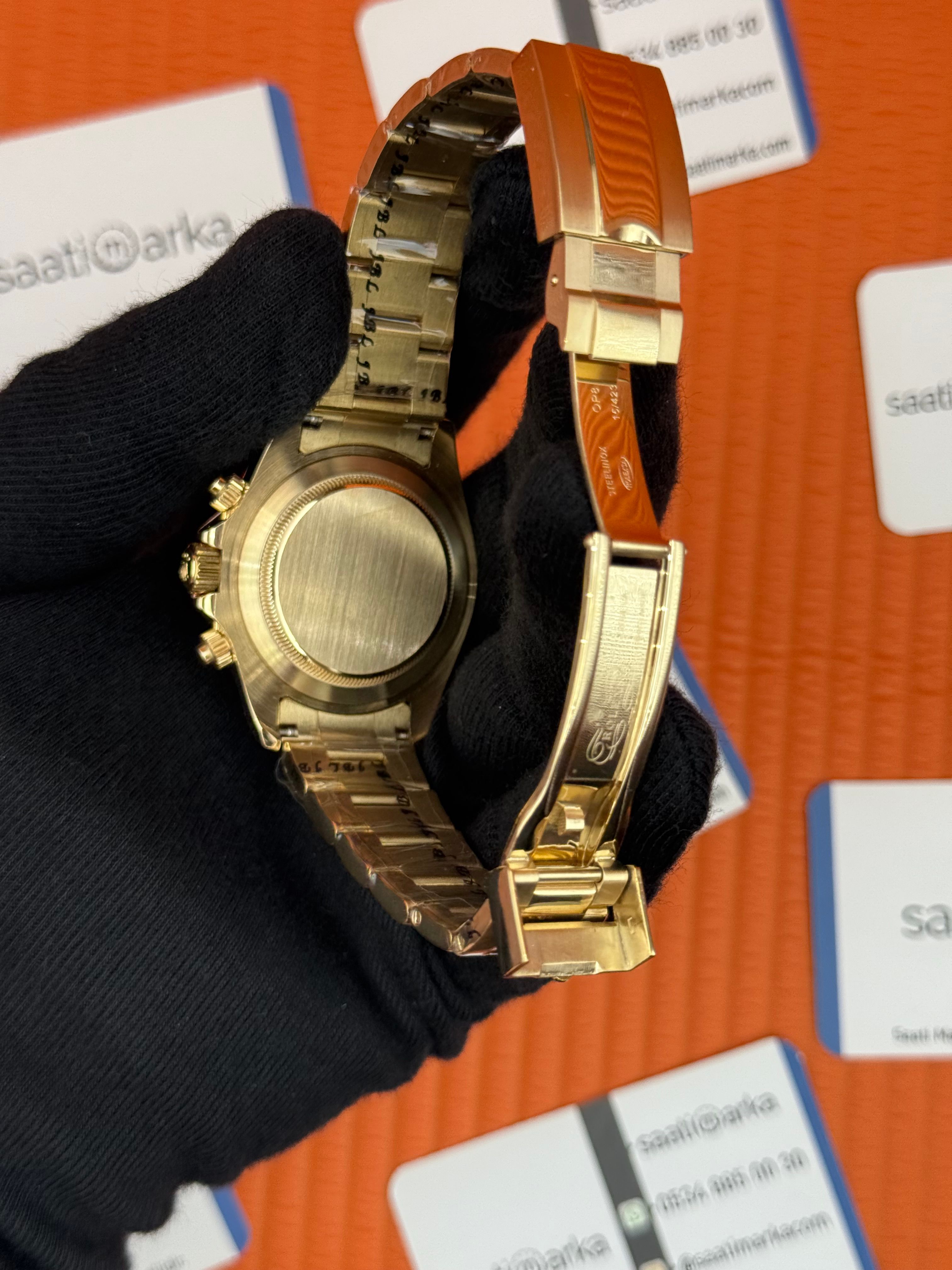 ROLEX Daytona black dial gold kasa-kordon