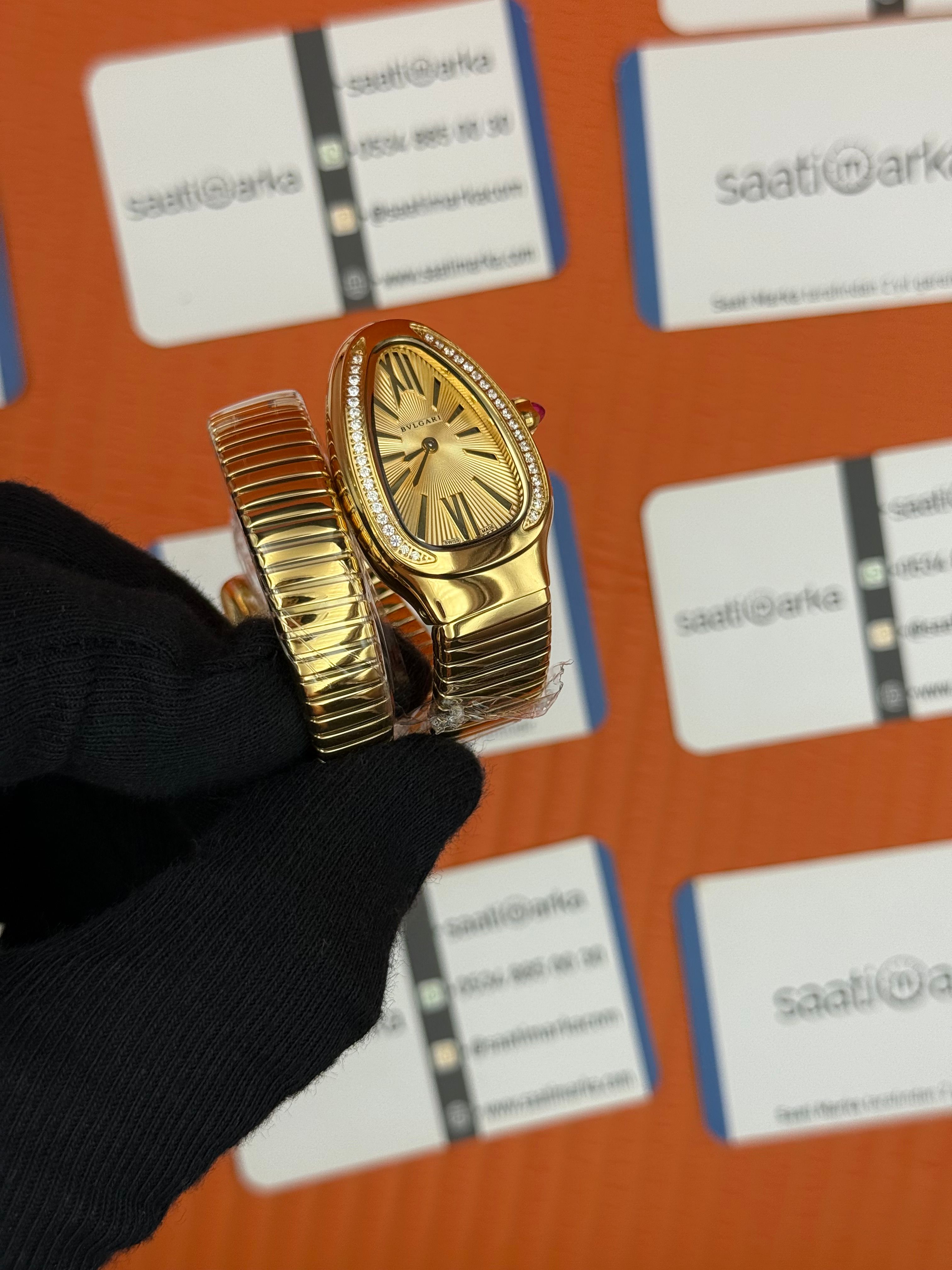 BVLGARİ serpenti tek sarma gold kordon taşlı bezel şampanya kadran kadın kol saati