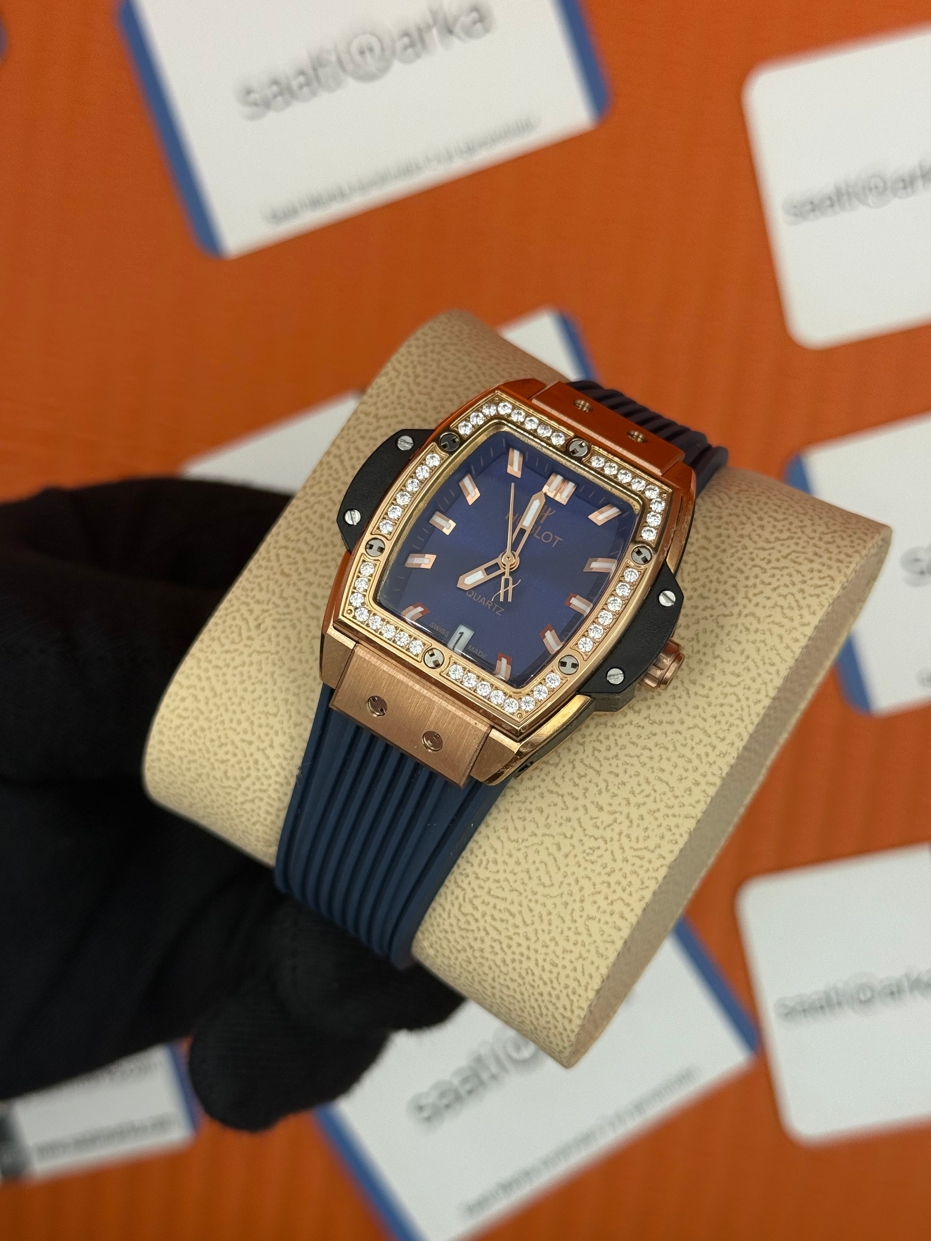 HUBLOT taşlı bezel rose kasa mavi kadran mavi kauçuk kordon kadın kol saati