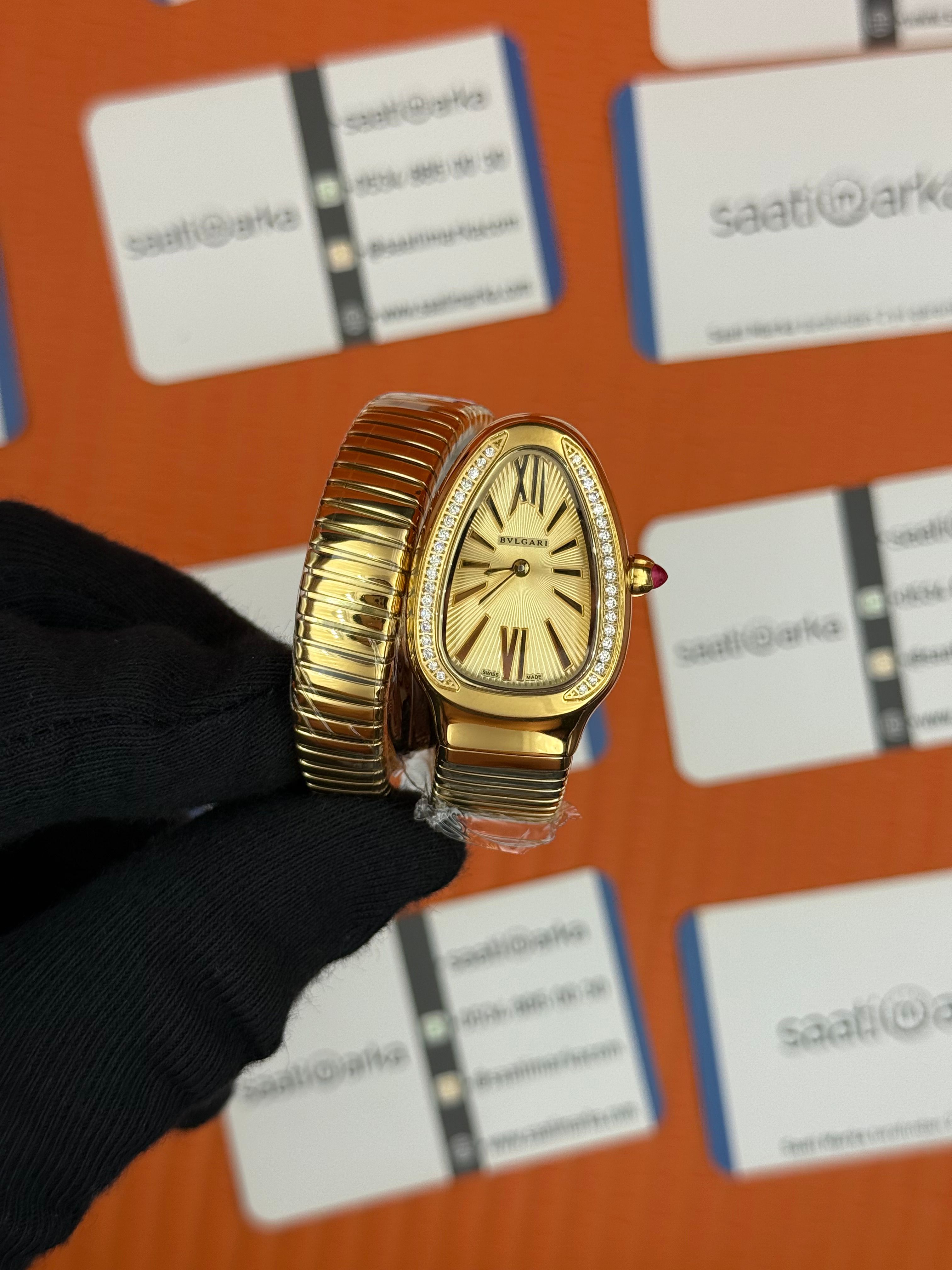 BVLGARİ serpenti tek sarma gold kordon taşlı bezel şampanya kadran kadın kol saati