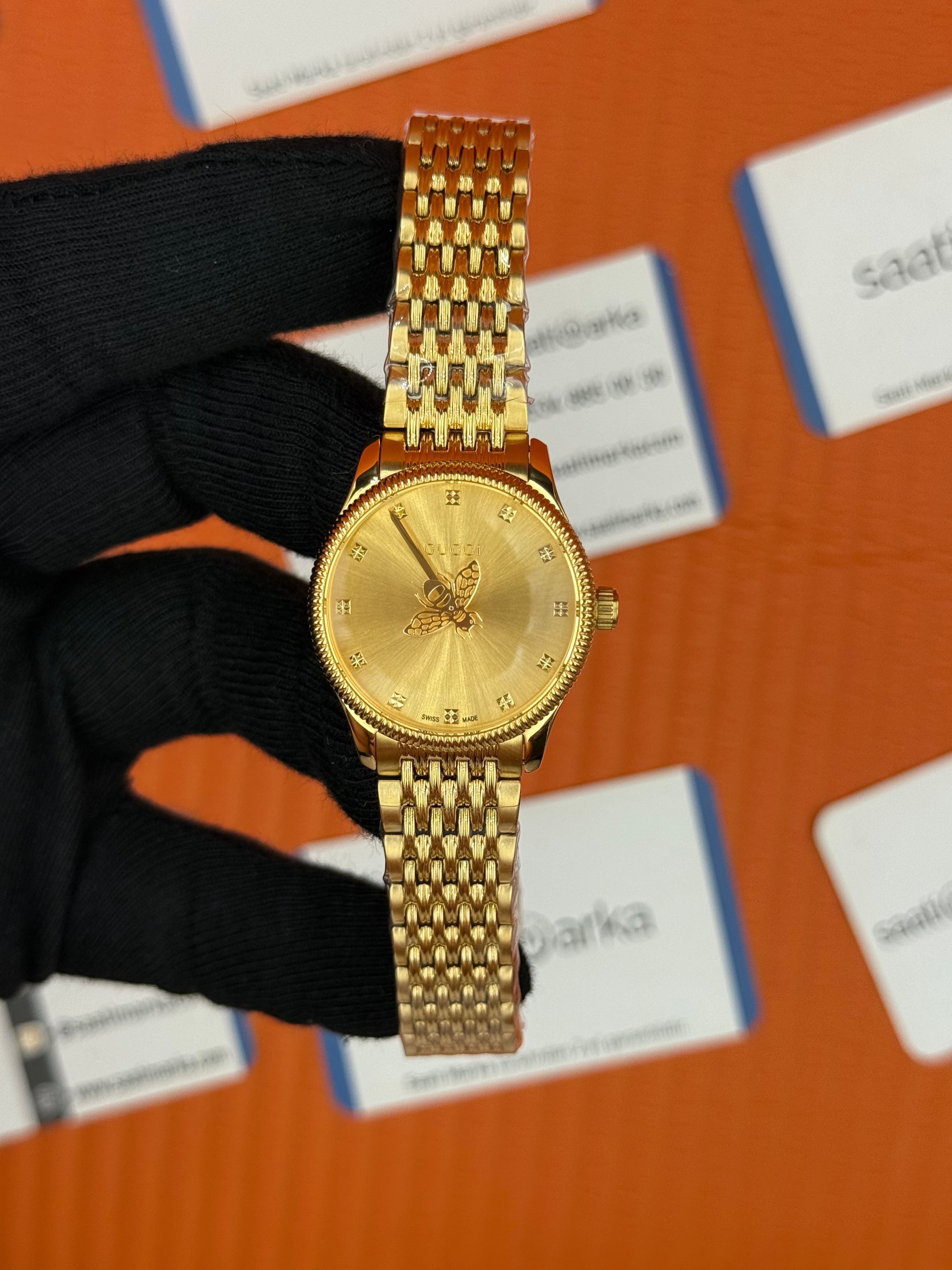 GUCCI şampanya kadran gold kasa kordon kadın kol saati