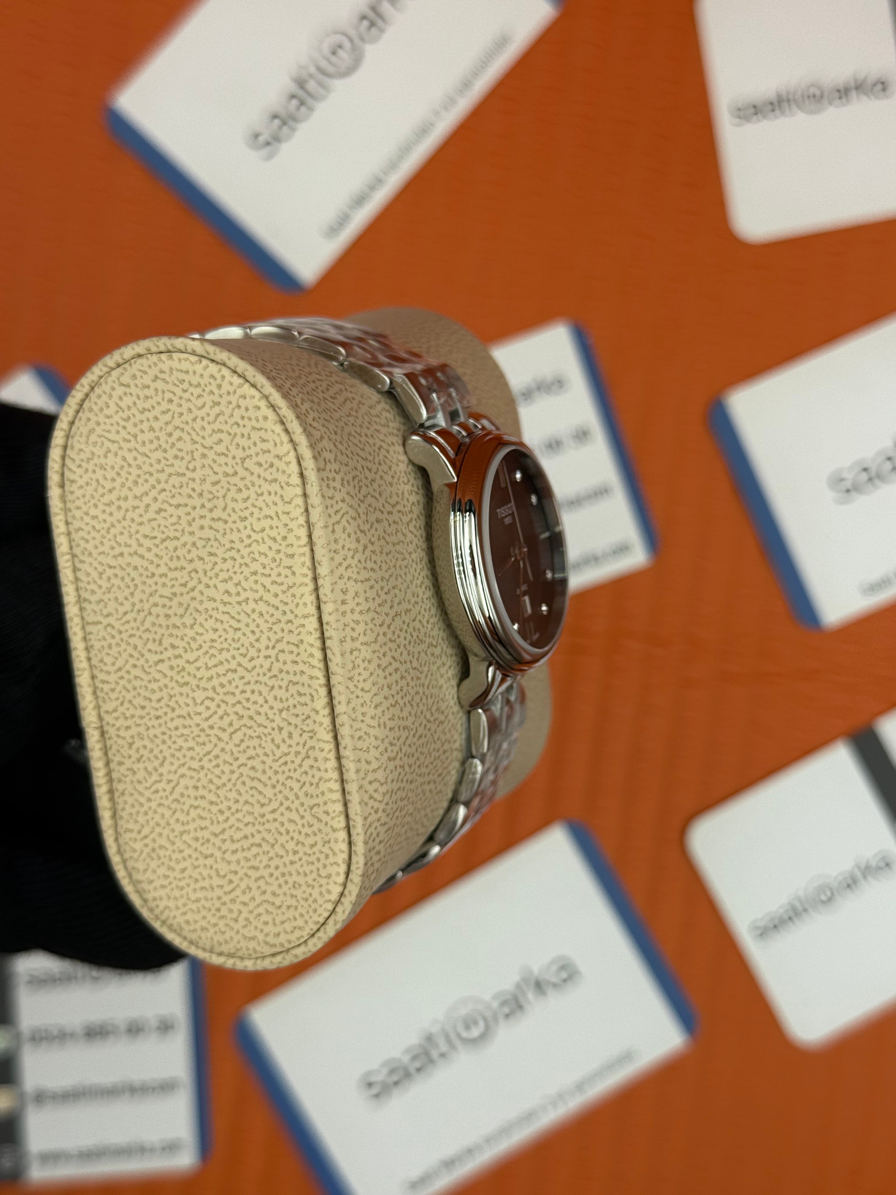 TISSOT siyah baget taşlı kadran silver kasa kordon kadın kol saati