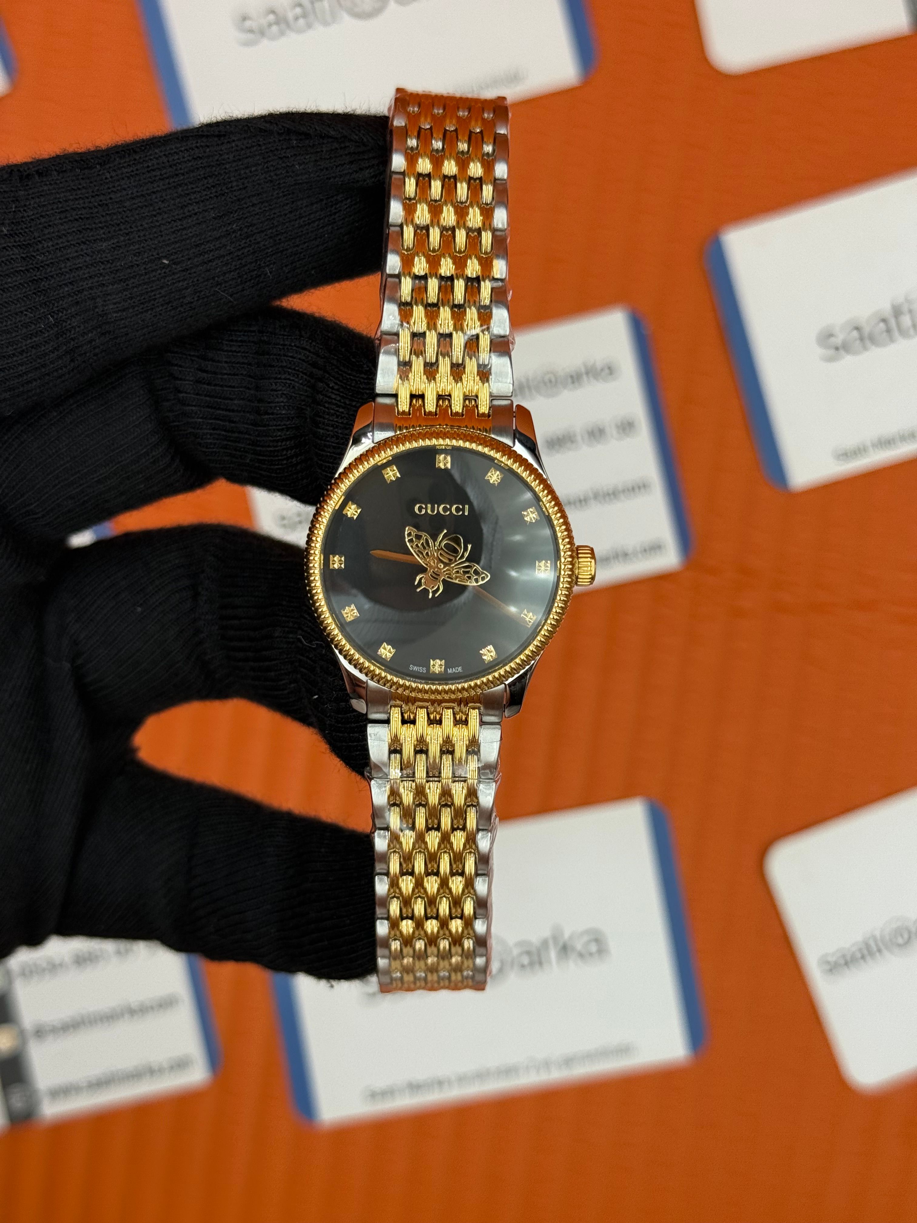 GUCCI siyah kadran gold silver kasa kordon kadın kol saati