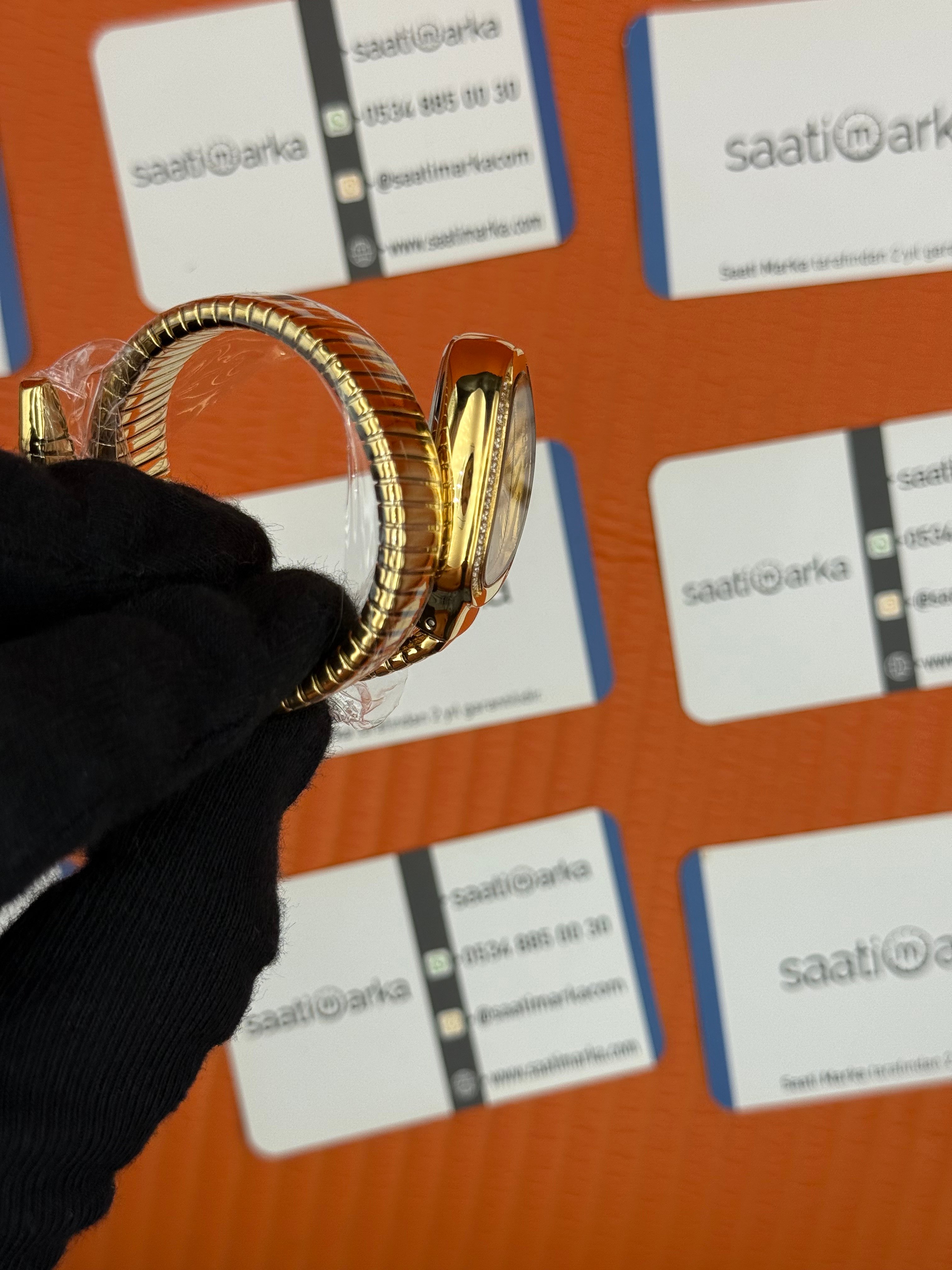 BVLGARİ serpenti tek sarma gold kordon taşlı bezel şampanya kadran kadın kol saati