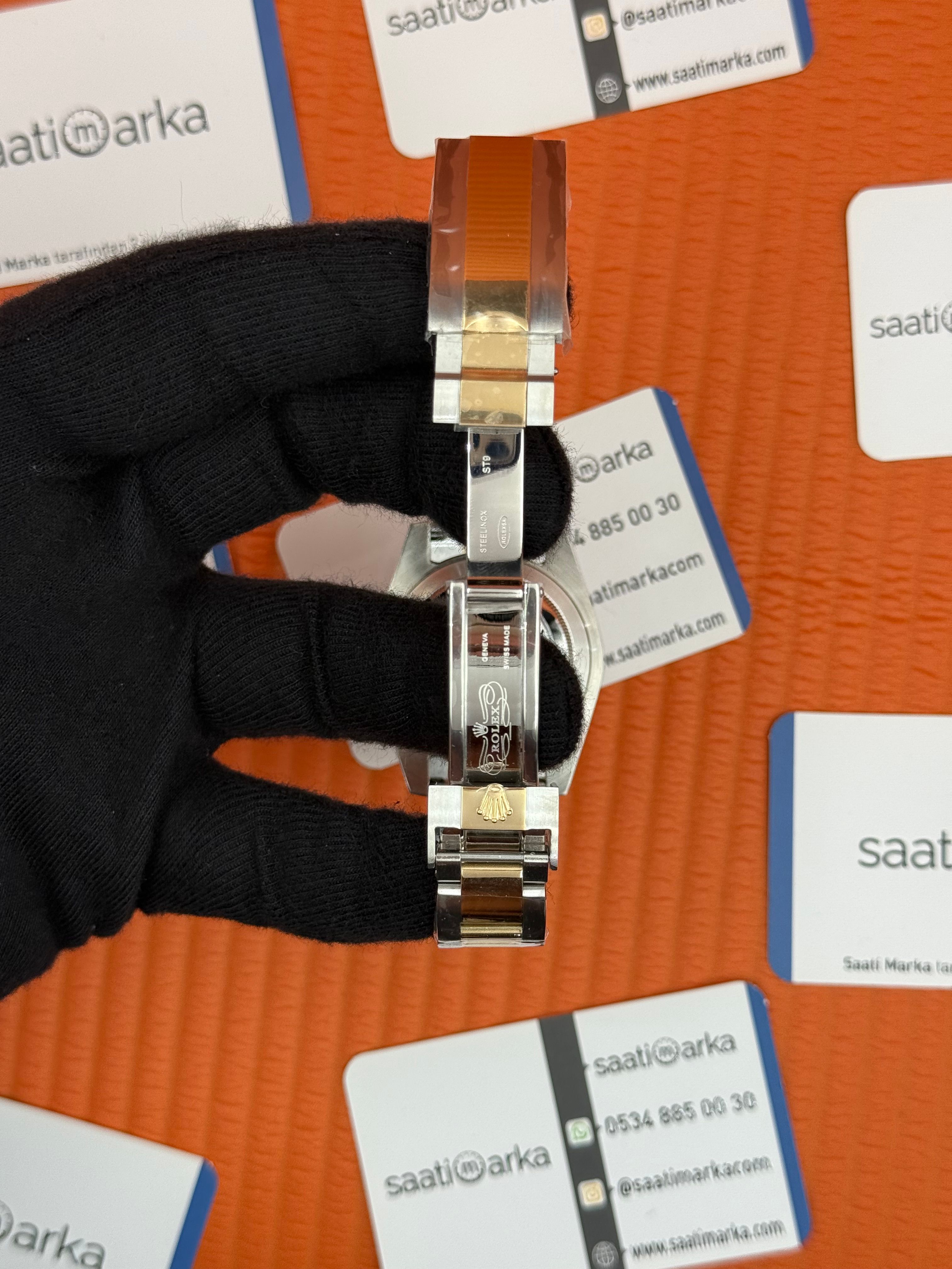 ROLEX Submariner oyster silver gold kordon black dial