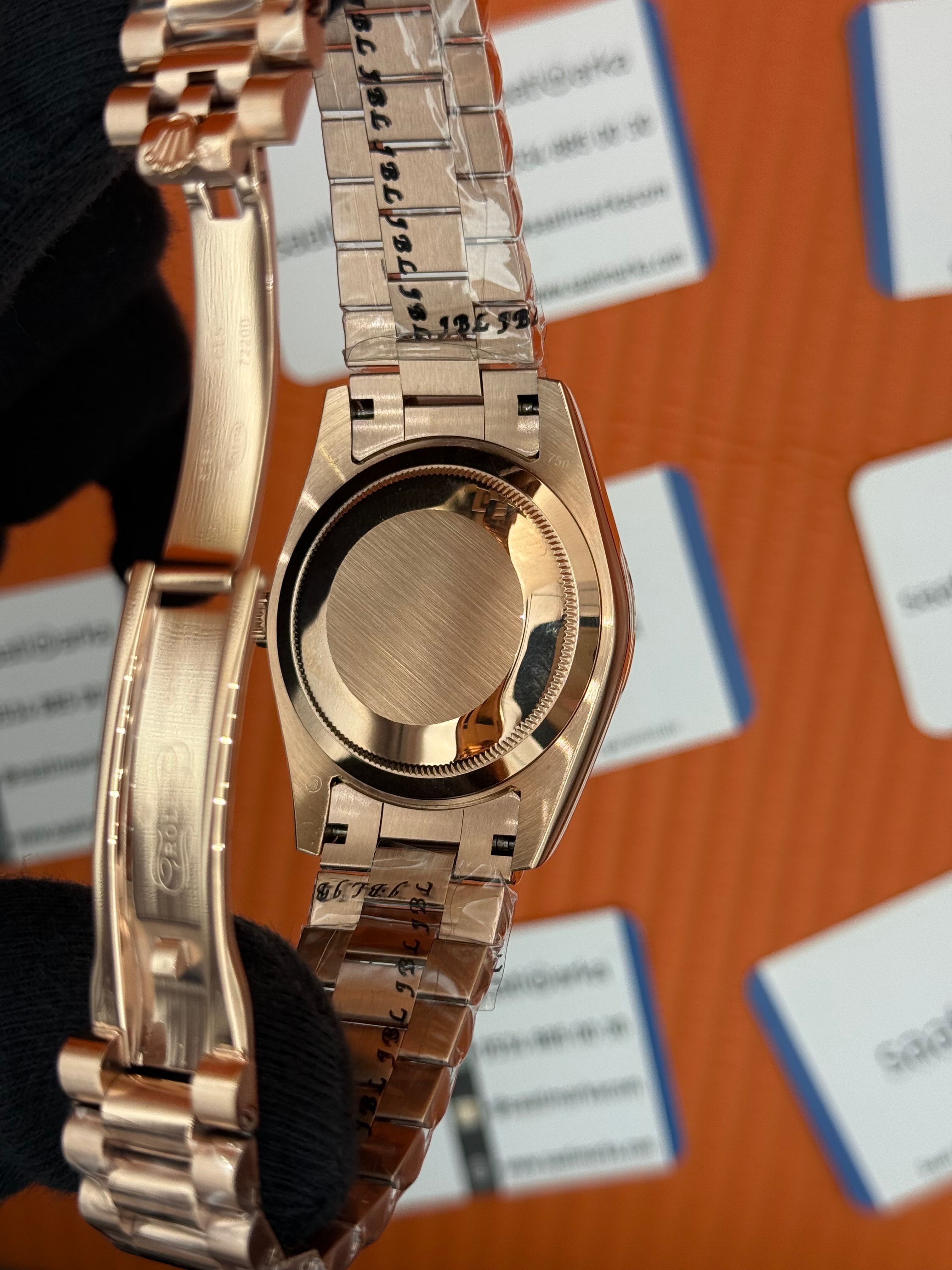 ROLEX Day Date roma rakamlı siyah kadran rose kasa-kordon oyster