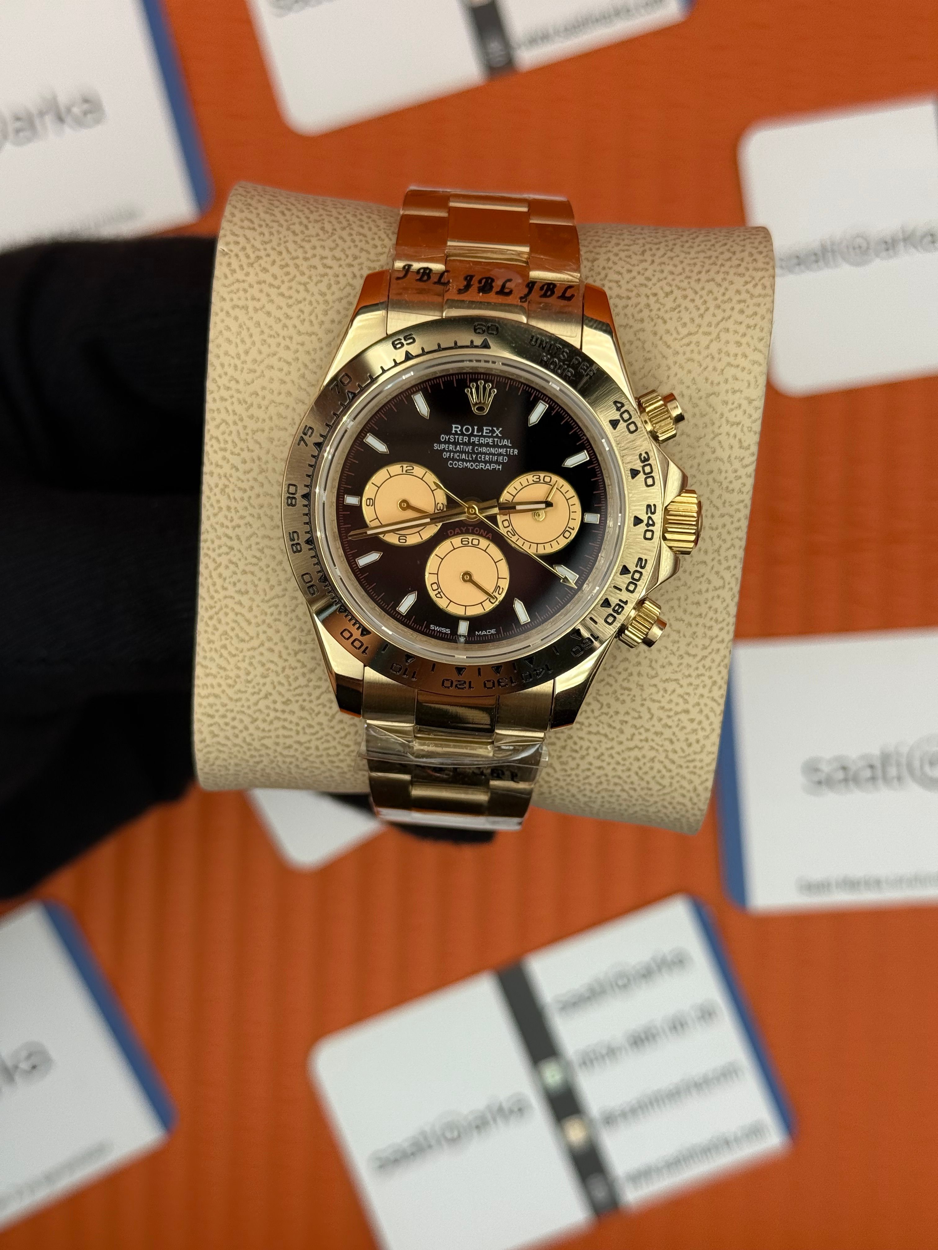 ROLEX Daytona black dial gold kasa-kordon