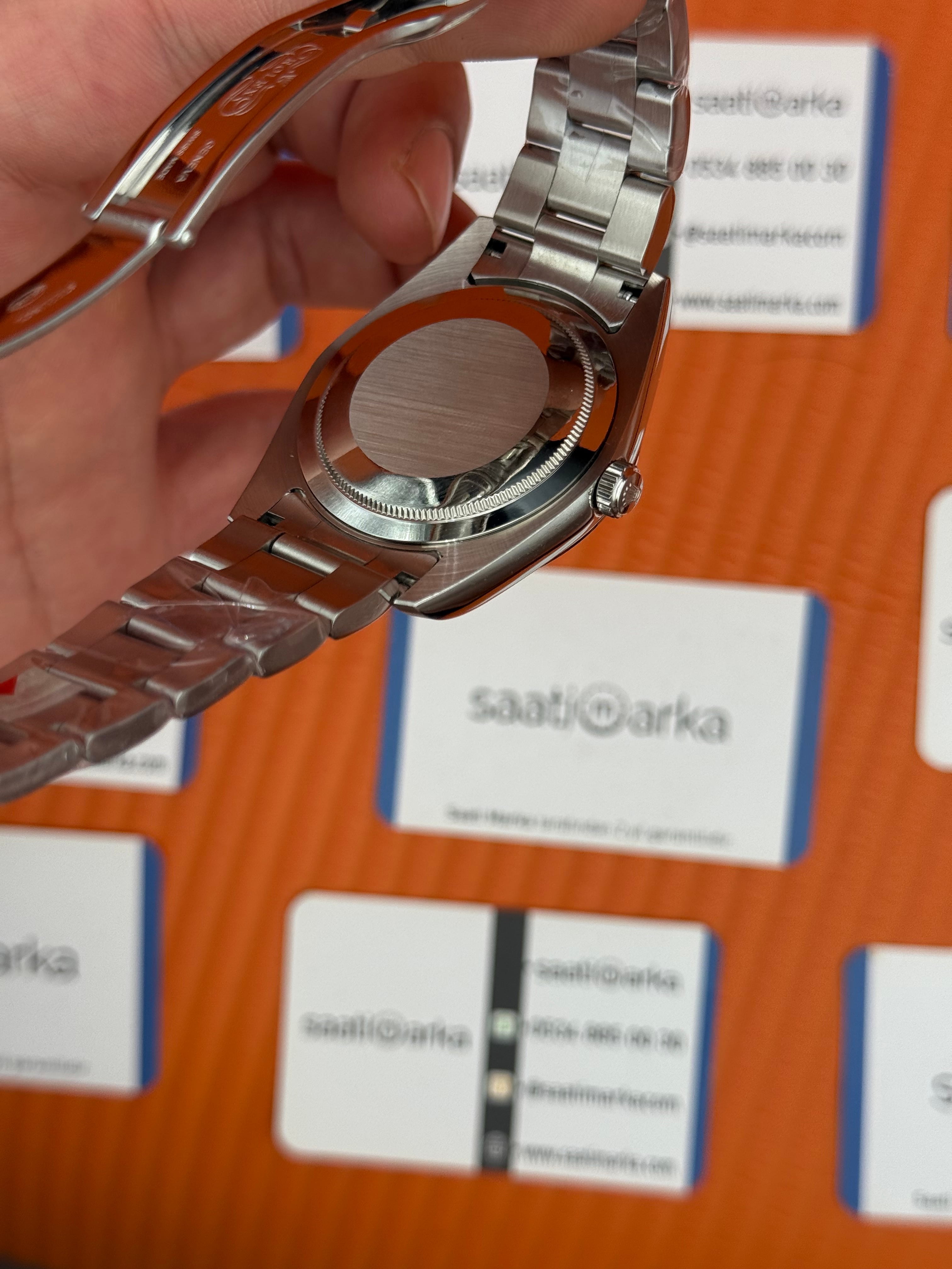 ROLEX oyster perpetual kırmızı kadran silver kasa kordon erkek kol saati