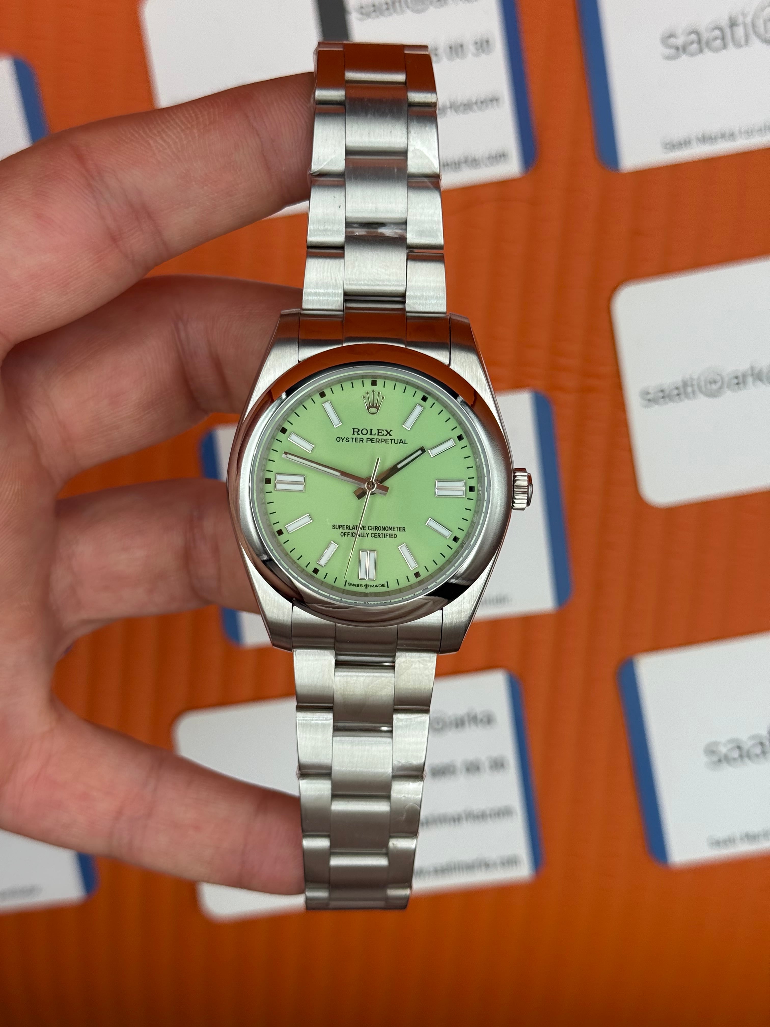 ROLEX oyster perpetual fıstık yeşili kadran silver kasa kordon erkek kol saati