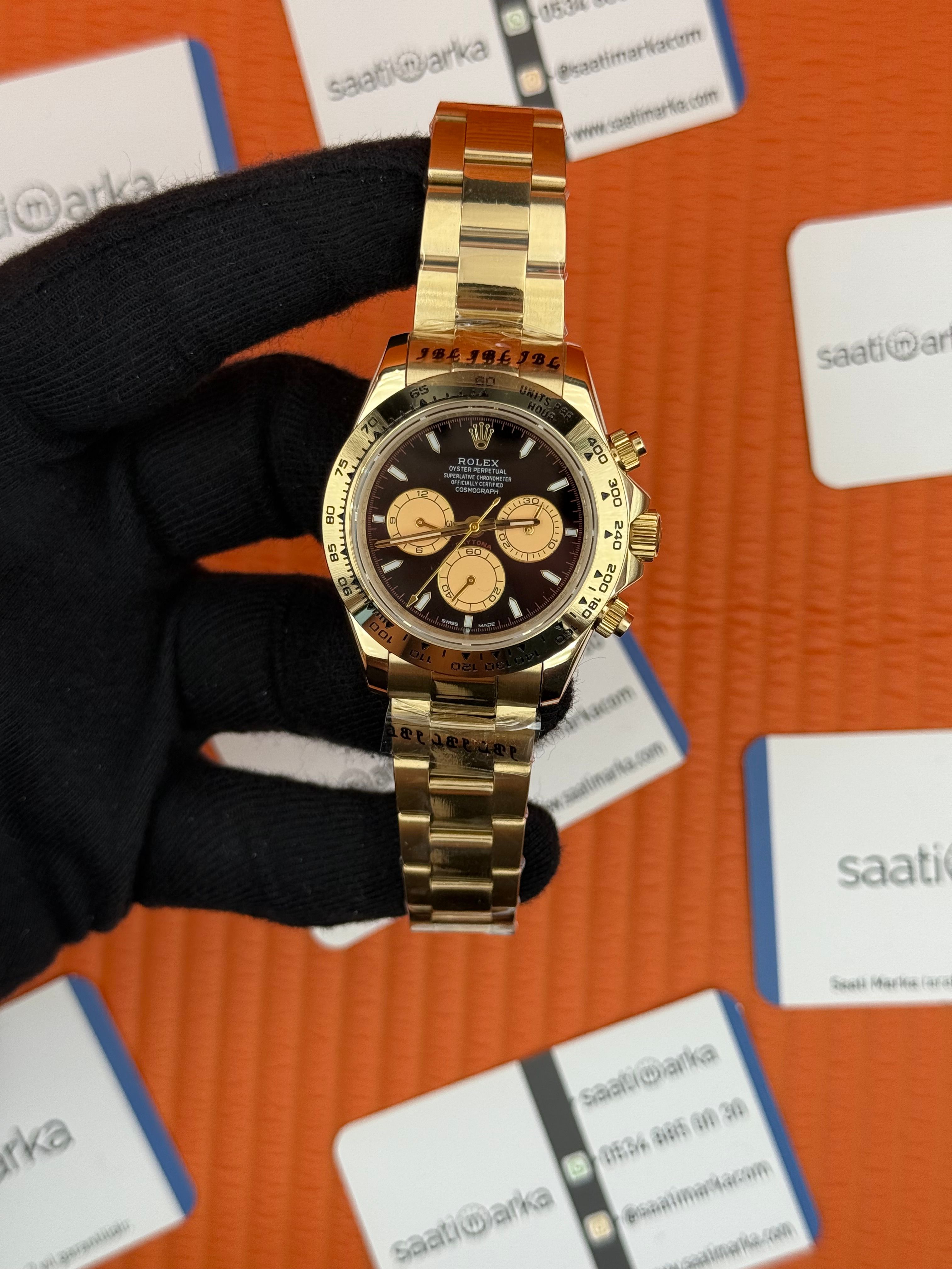 ROLEX Daytona black dial gold kasa-kordon