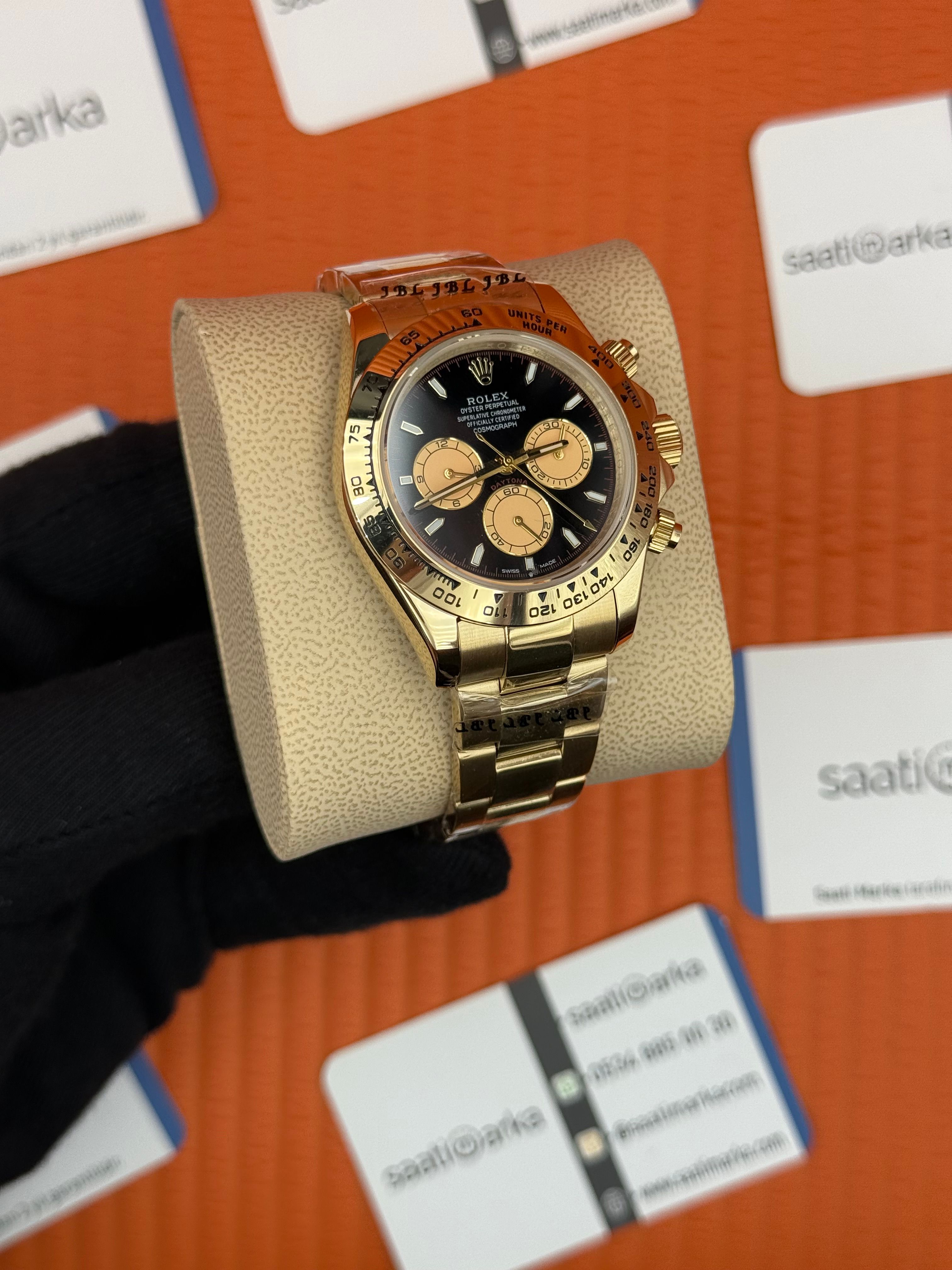 ROLEX Daytona black dial gold kasa-kordon