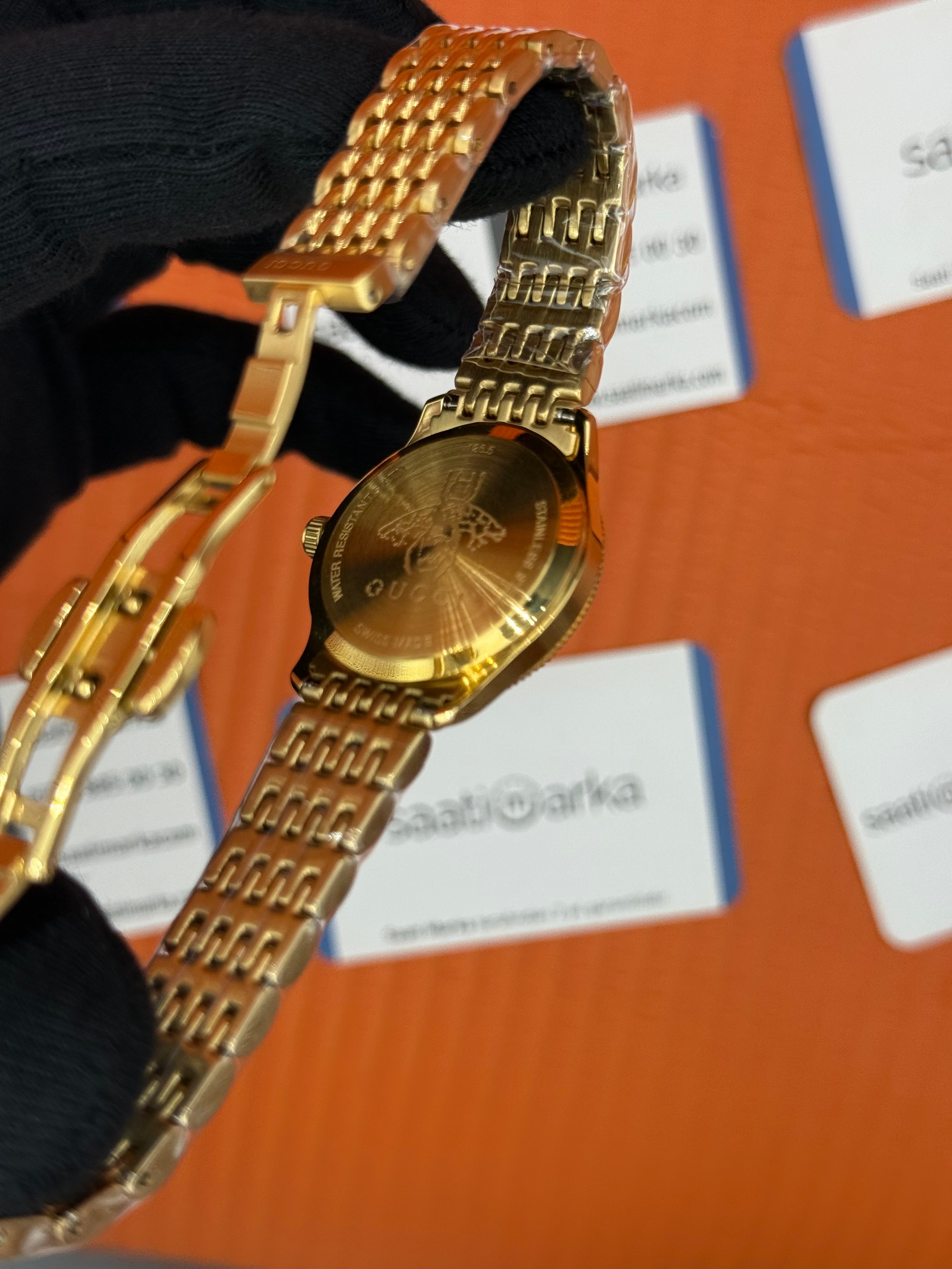 GUCCI şampanya kadran gold kasa kordon kadın kol saati