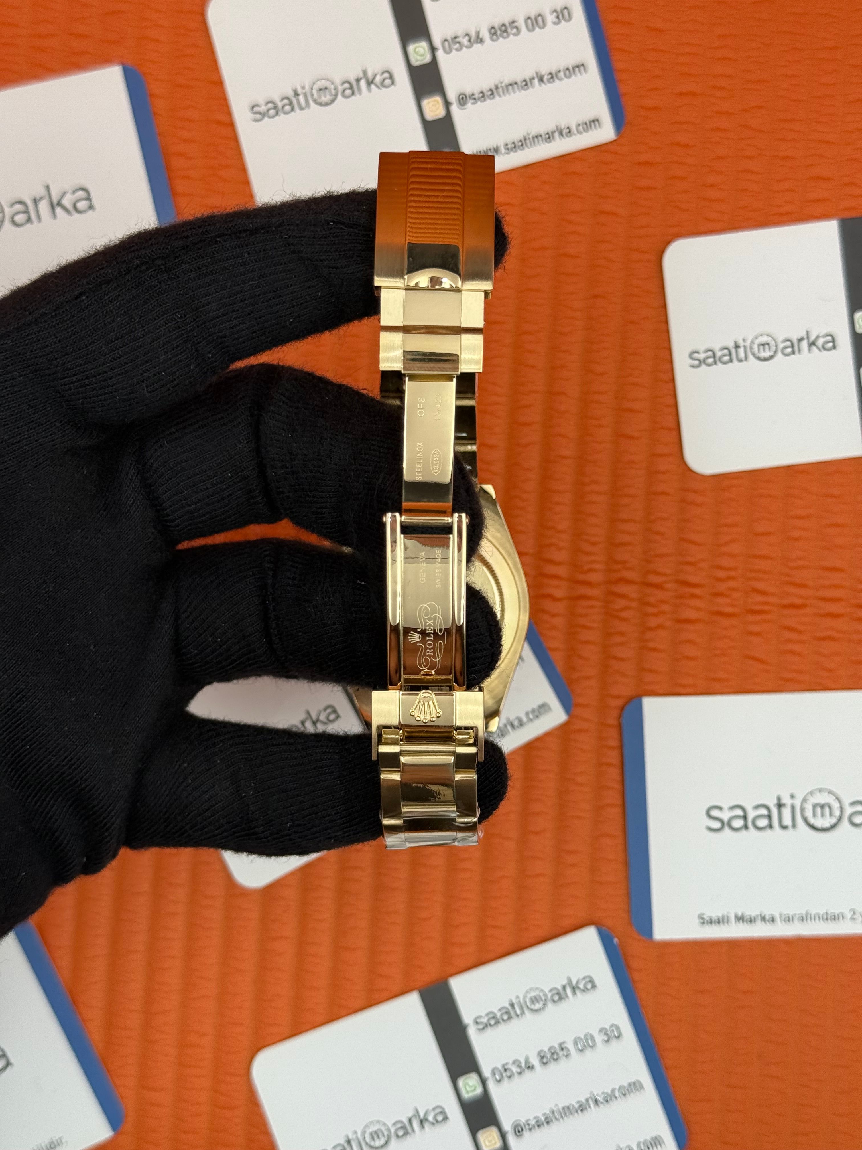 ROLEX Daytona black dial gold kasa-kordon