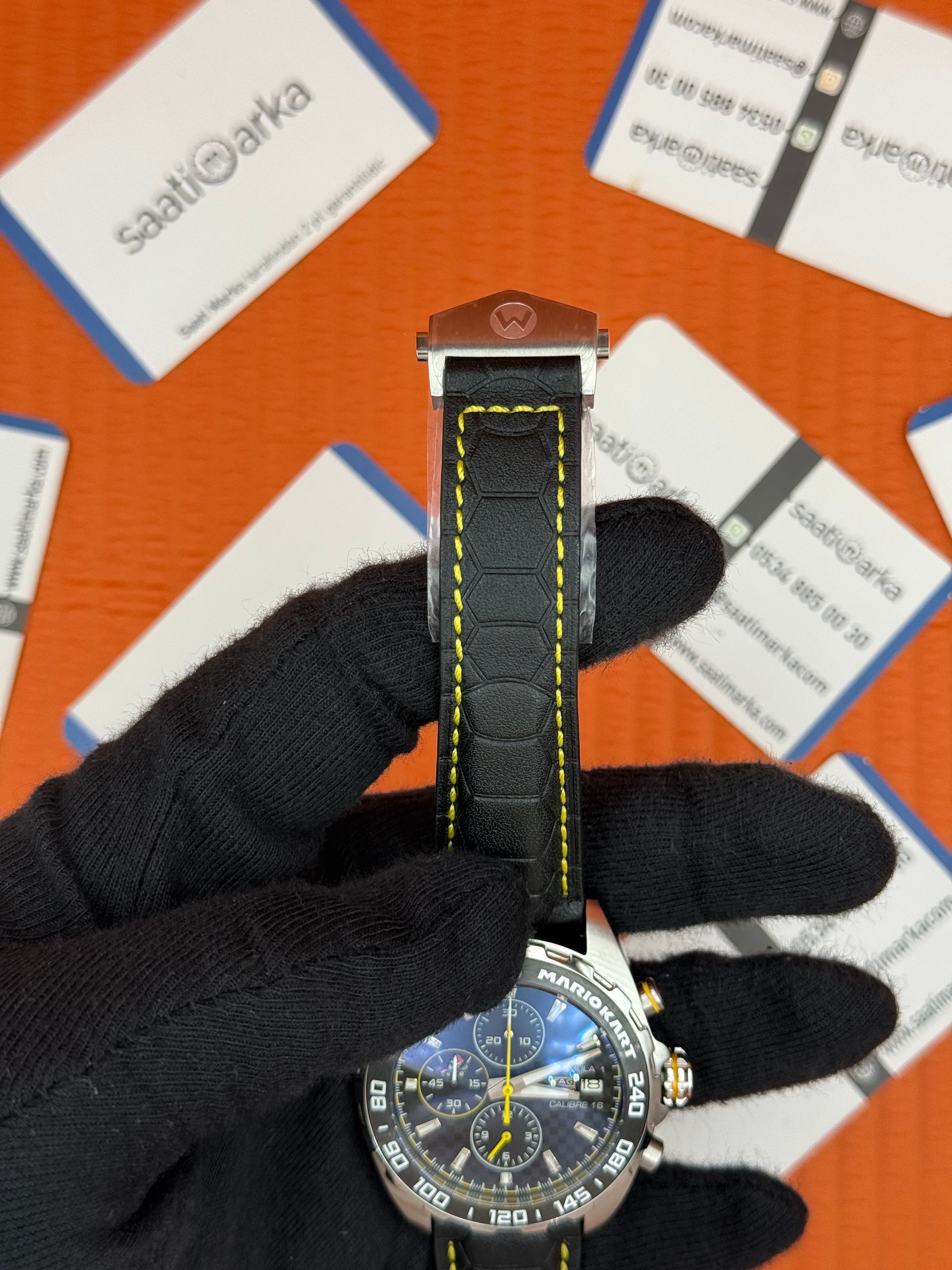 TAGHEUER FORMULA SİYAH DERİ KORDONLU SİYAH SARI DETAYLI KADRAN 