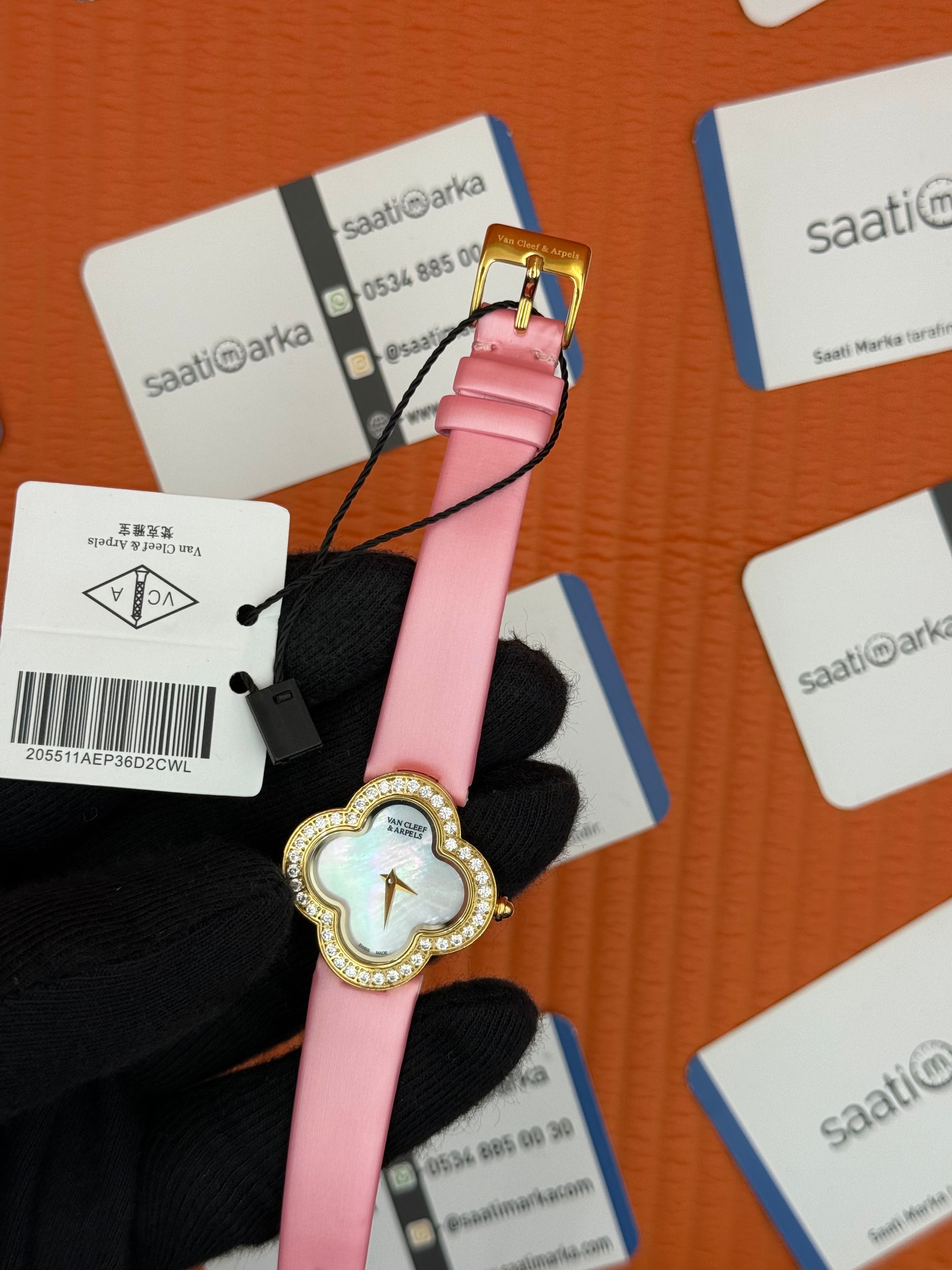 VAN CLEEF beyaz kadran pembe deri kordon gold kasa taşlı bezel kadın kol saati