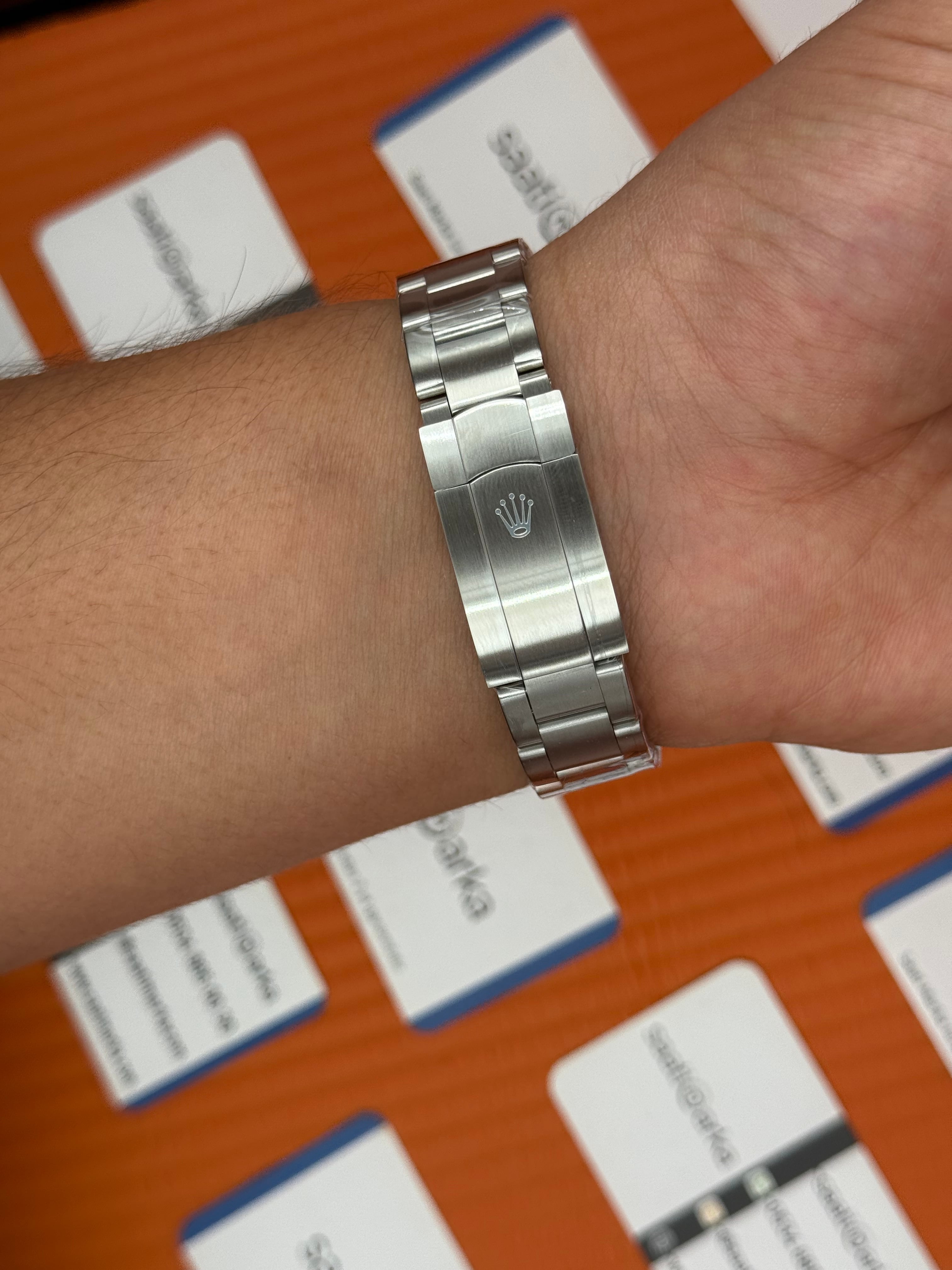 ROLEX oyster perpetual kırmızı kadran silver kasa kordon erkek kol saati