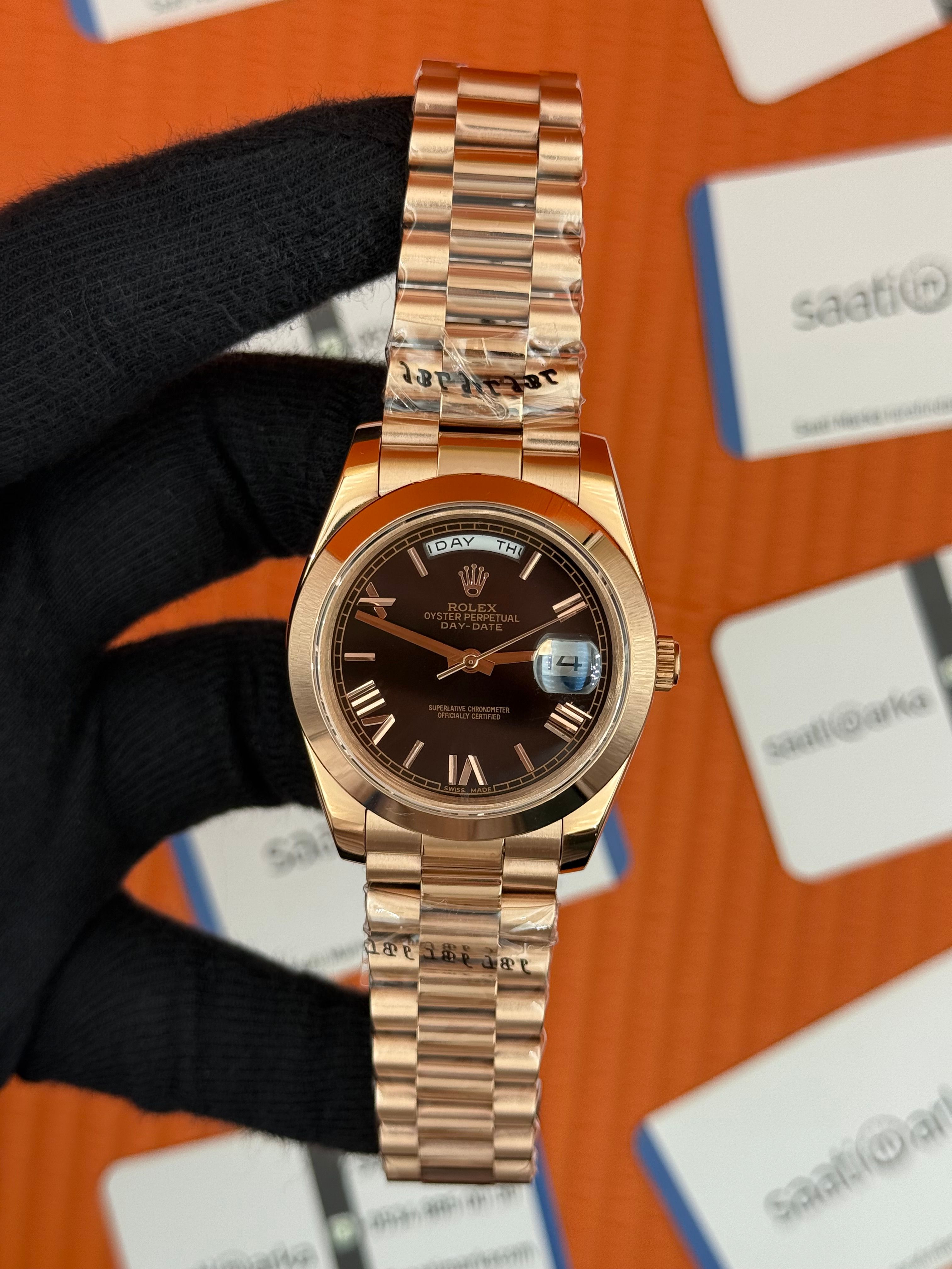 ROLEX Day Date roma rakamlı siyah kadran rose kasa-kordon oyster