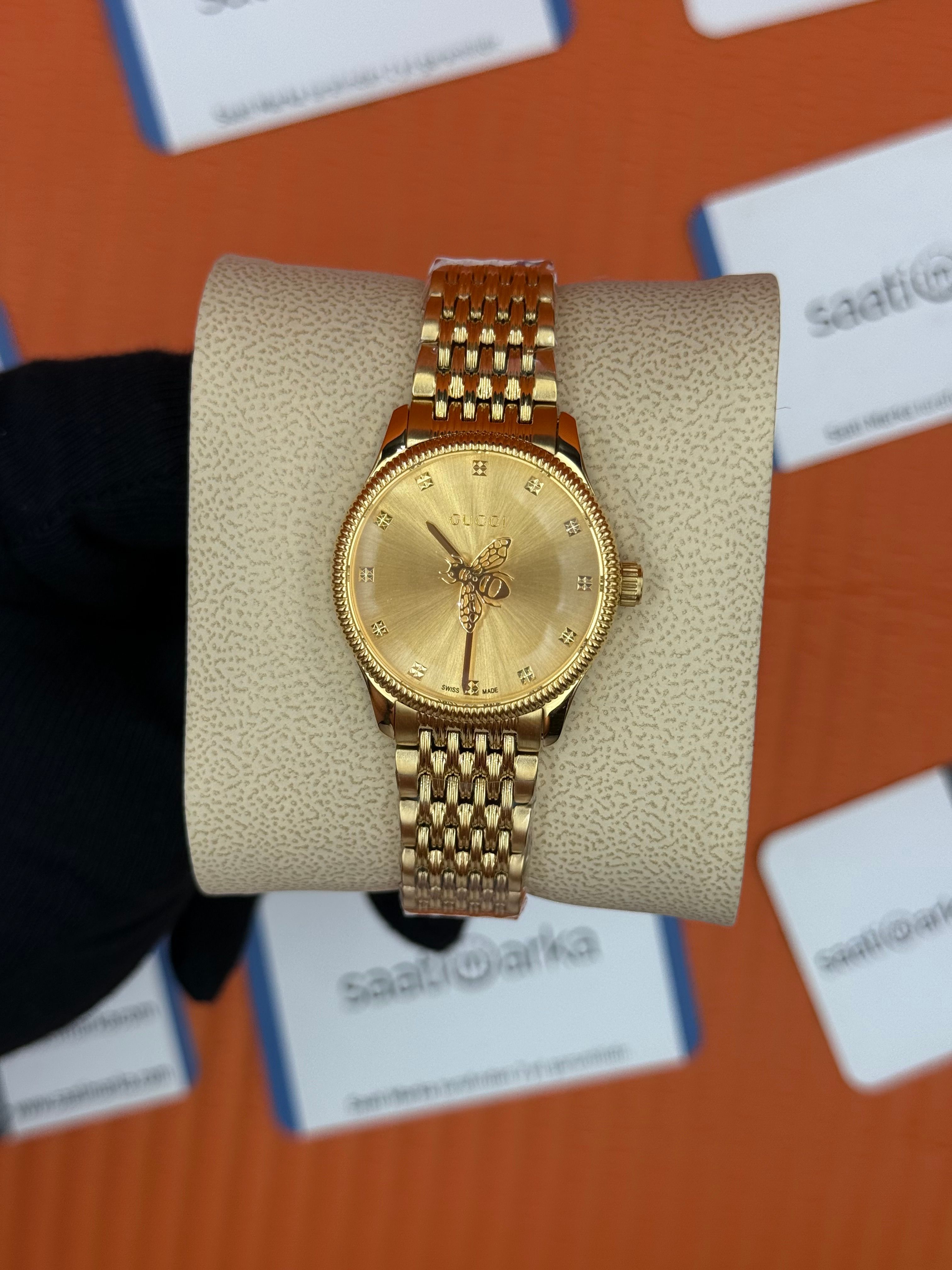 GUCCI şampanya kadran gold kasa kordon kadın kol saati