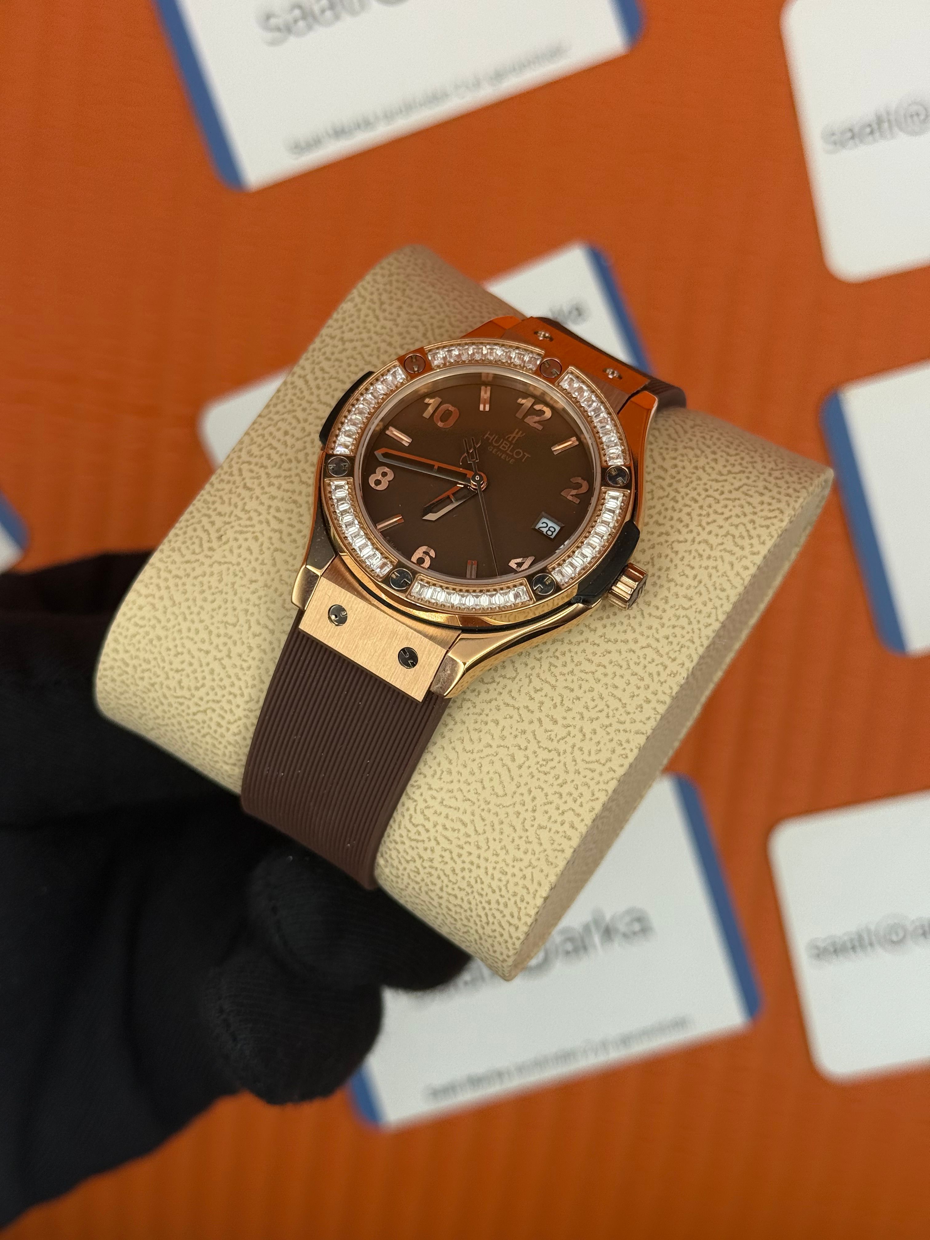 HUBLOT taşlı bezel kahverengi kadran rose kasa kahverengi kauçuk kordon kadın kol saati