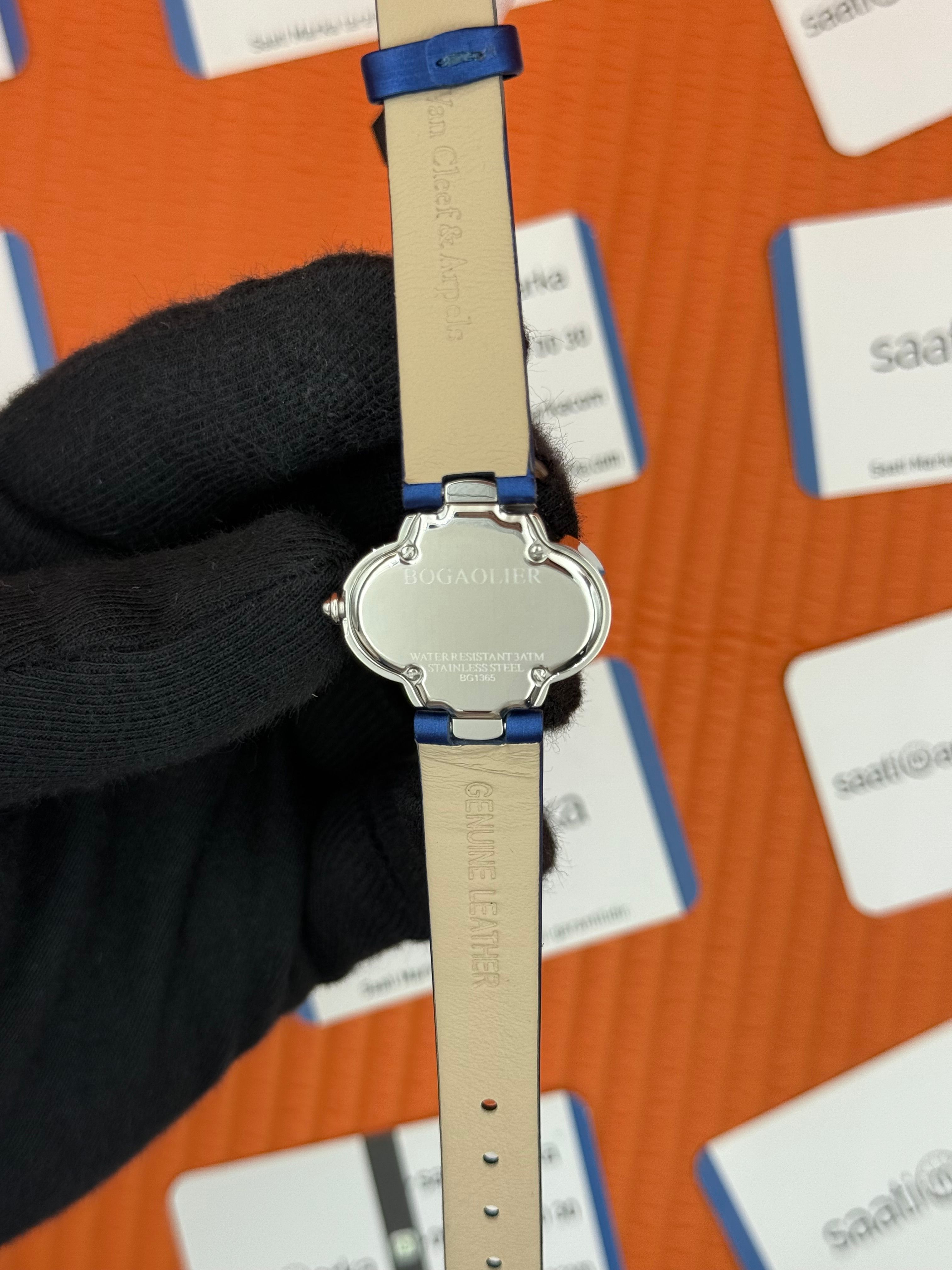 VAN CLEEF beyaz kadran mavi deri kordon silver kasa taşlı bezel kadın kol saati