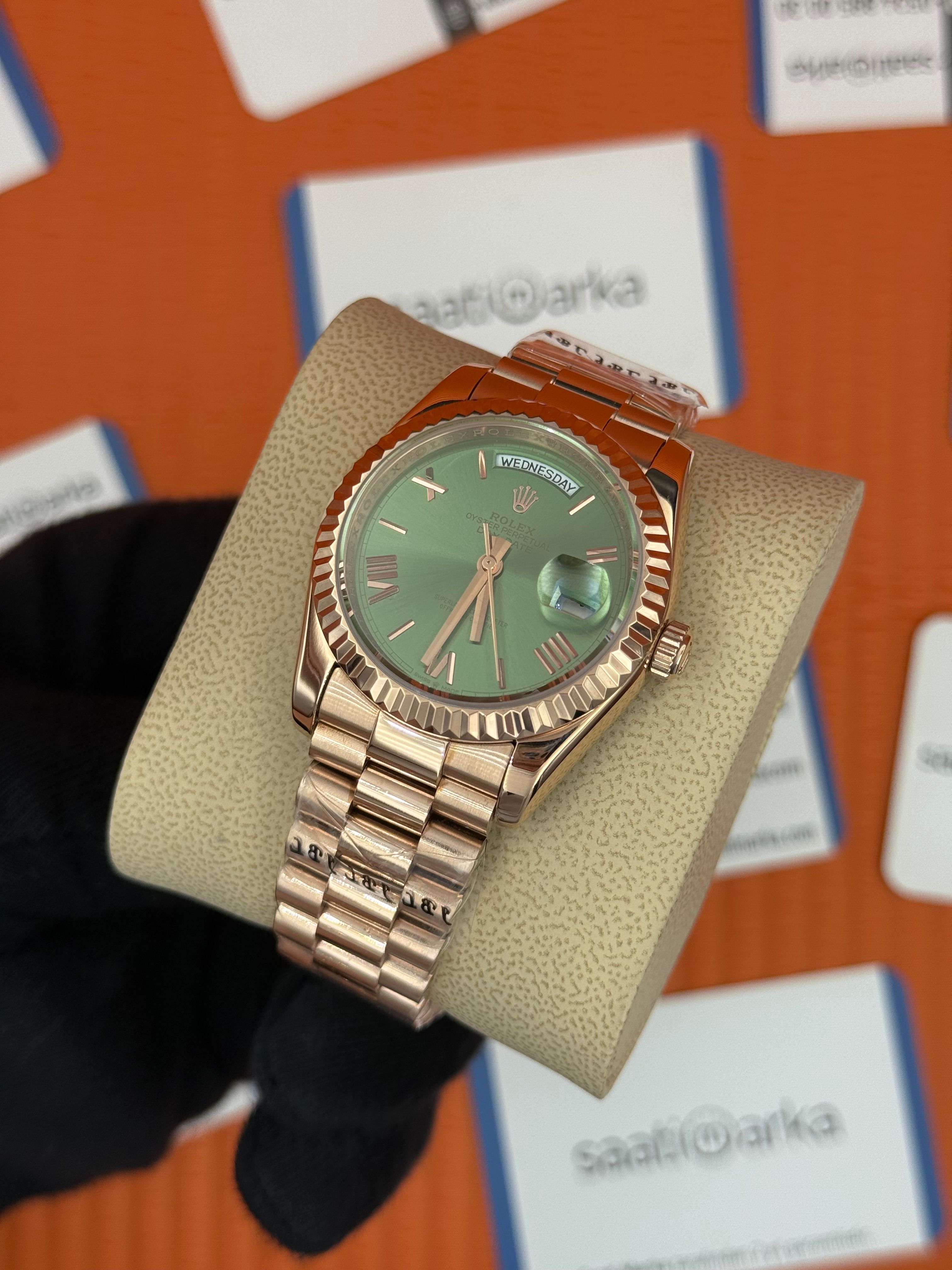 ROLEX day date 36mm yeşil roma rakamlı kadran rose kasa-kordon president 