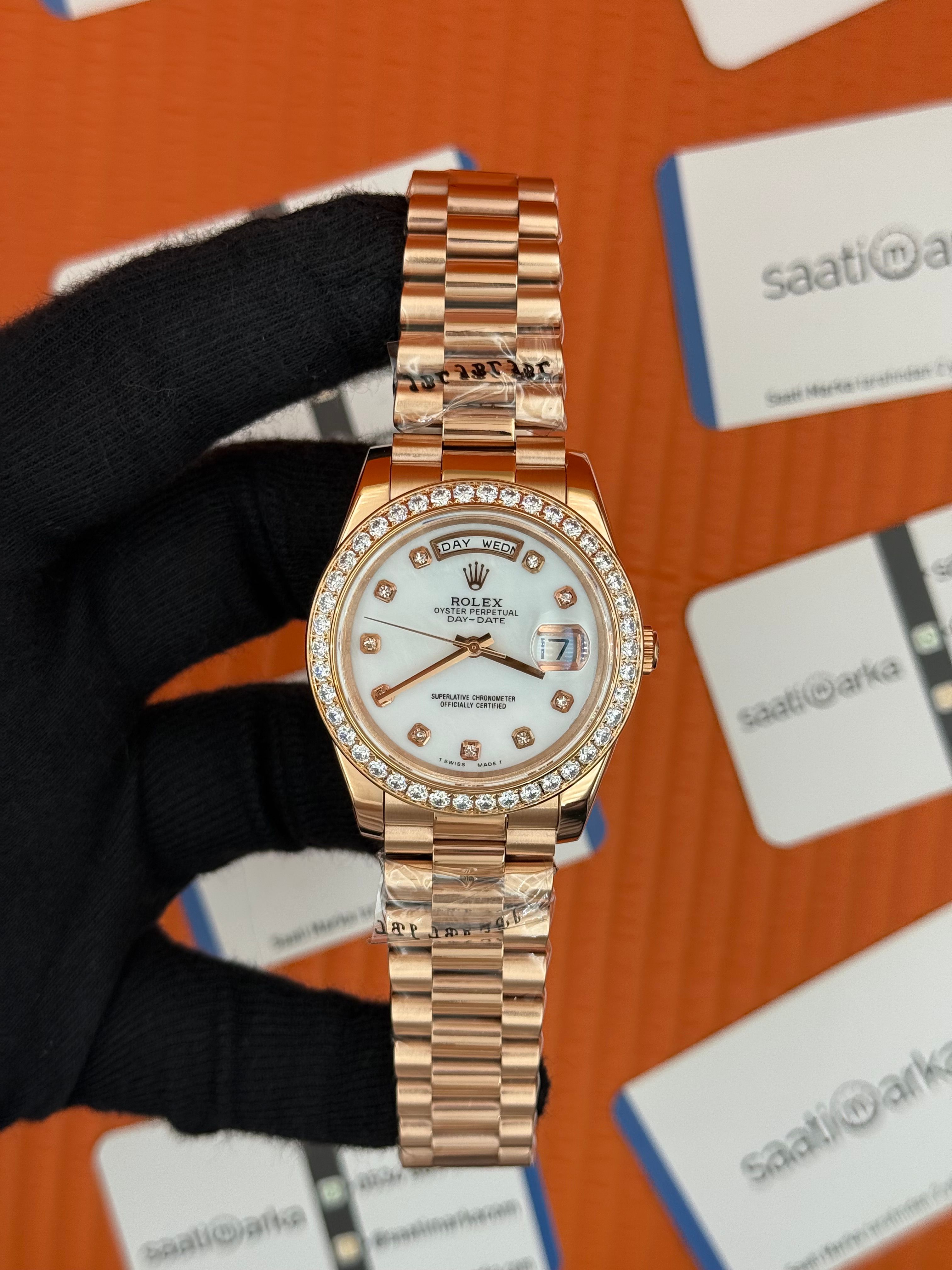 ROLEX Day Date baget taşlı beyaz kadran rose kasa-kordon oyster